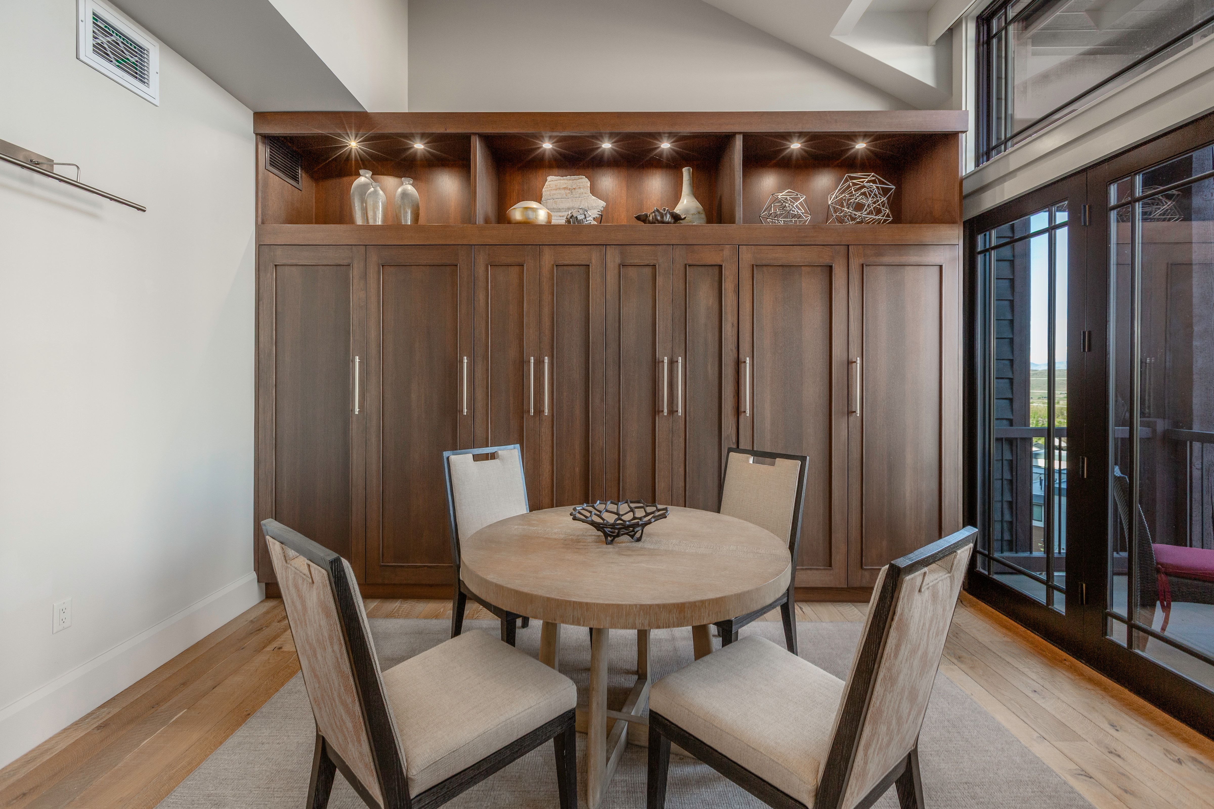 Built-in cabinetry with integrated shelving and recessed lighting