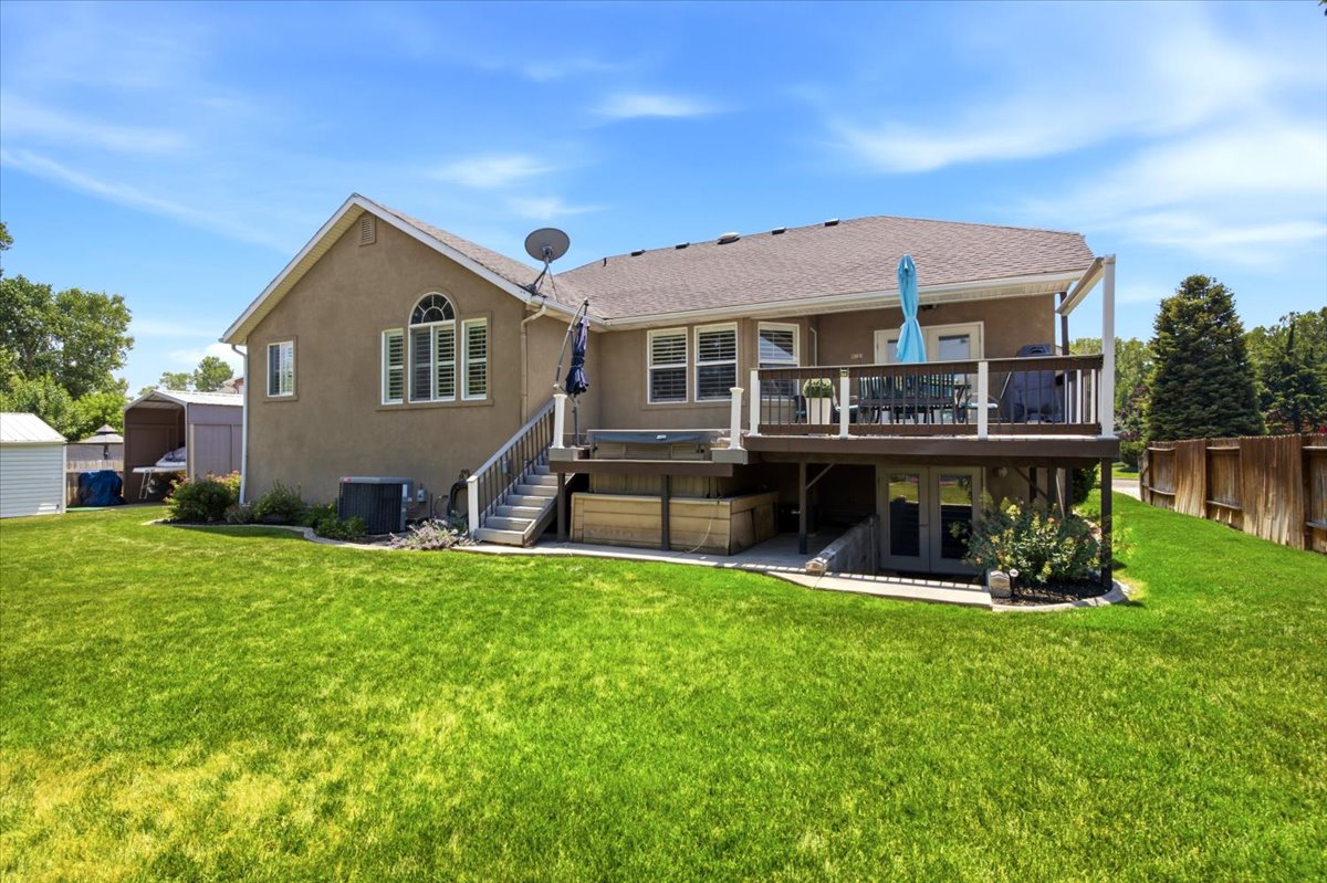 Trex deck with built-in hot tub, private fenced & landscaped yard with no neighbors behind, mature trees, permanent holiday lights, shed/workshop with power (fit your ATV!) covered, extra high RV/boat parking (approximately 10’ x 18’), & solar panels