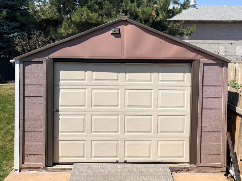 Detached garage/shed/workshop with power! Opening is 6 ft high, 8 ft wide, and will fit a car or ATV.