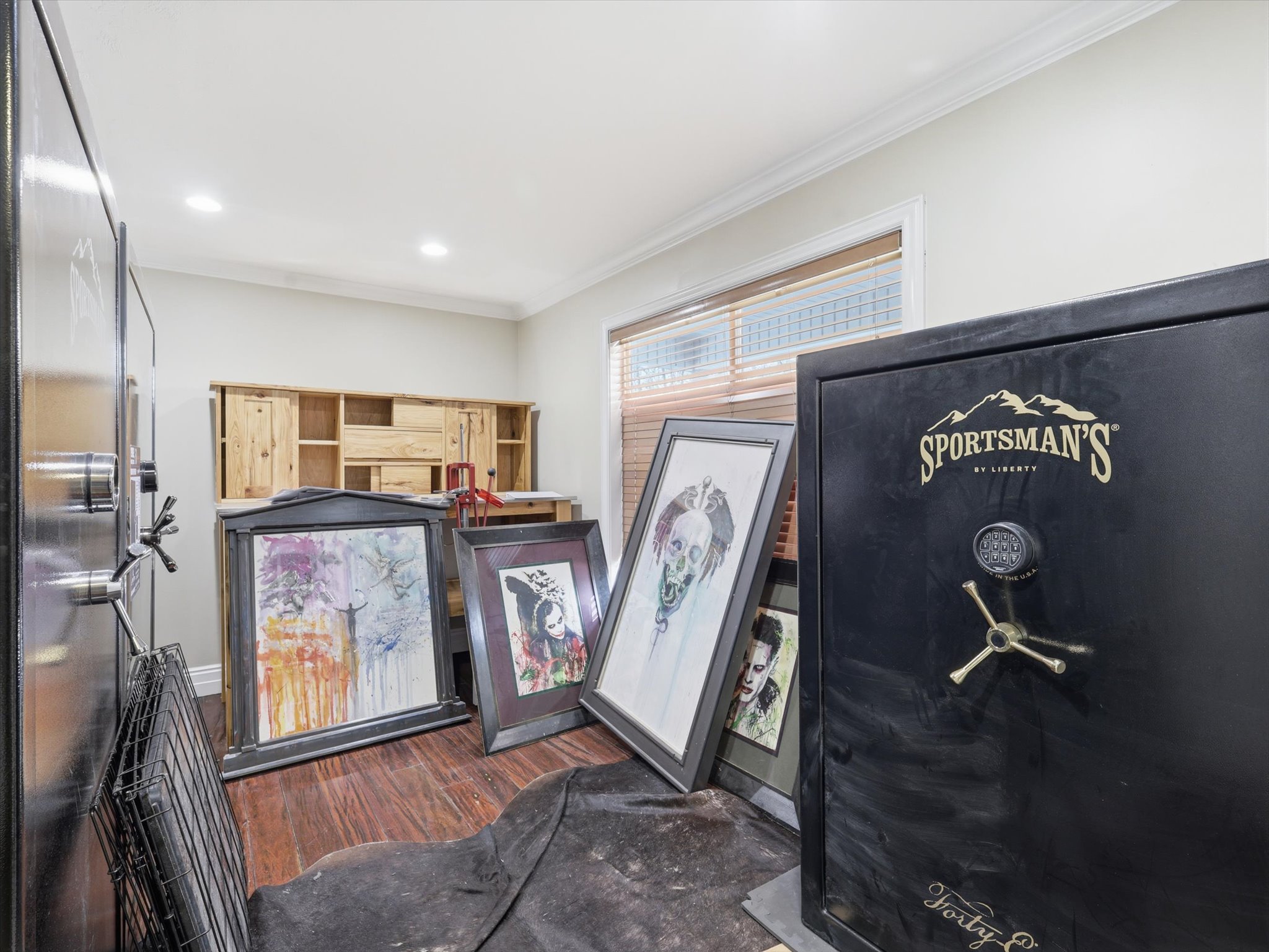 Recessed ceiling lighting illuminates wood-finish flooring