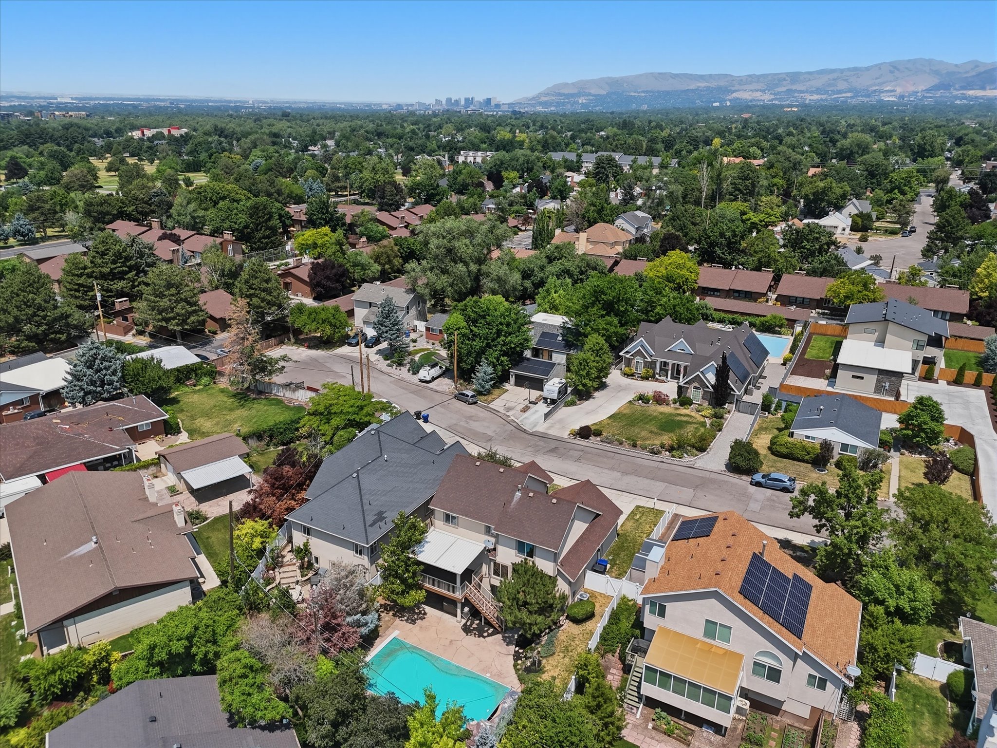 Aerial perspective showcasing residential properties with mature landscaping