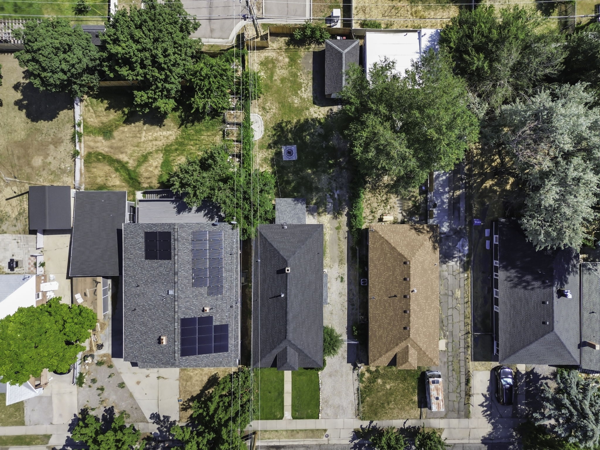 Aerial perspective showcasing two properties with distinct features