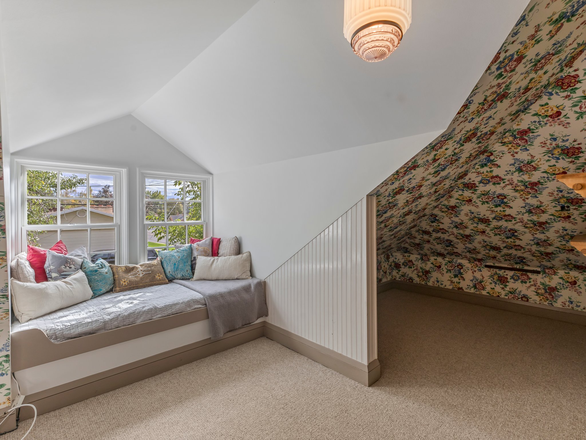 Built-in window seat with storage base and two double-hung windows