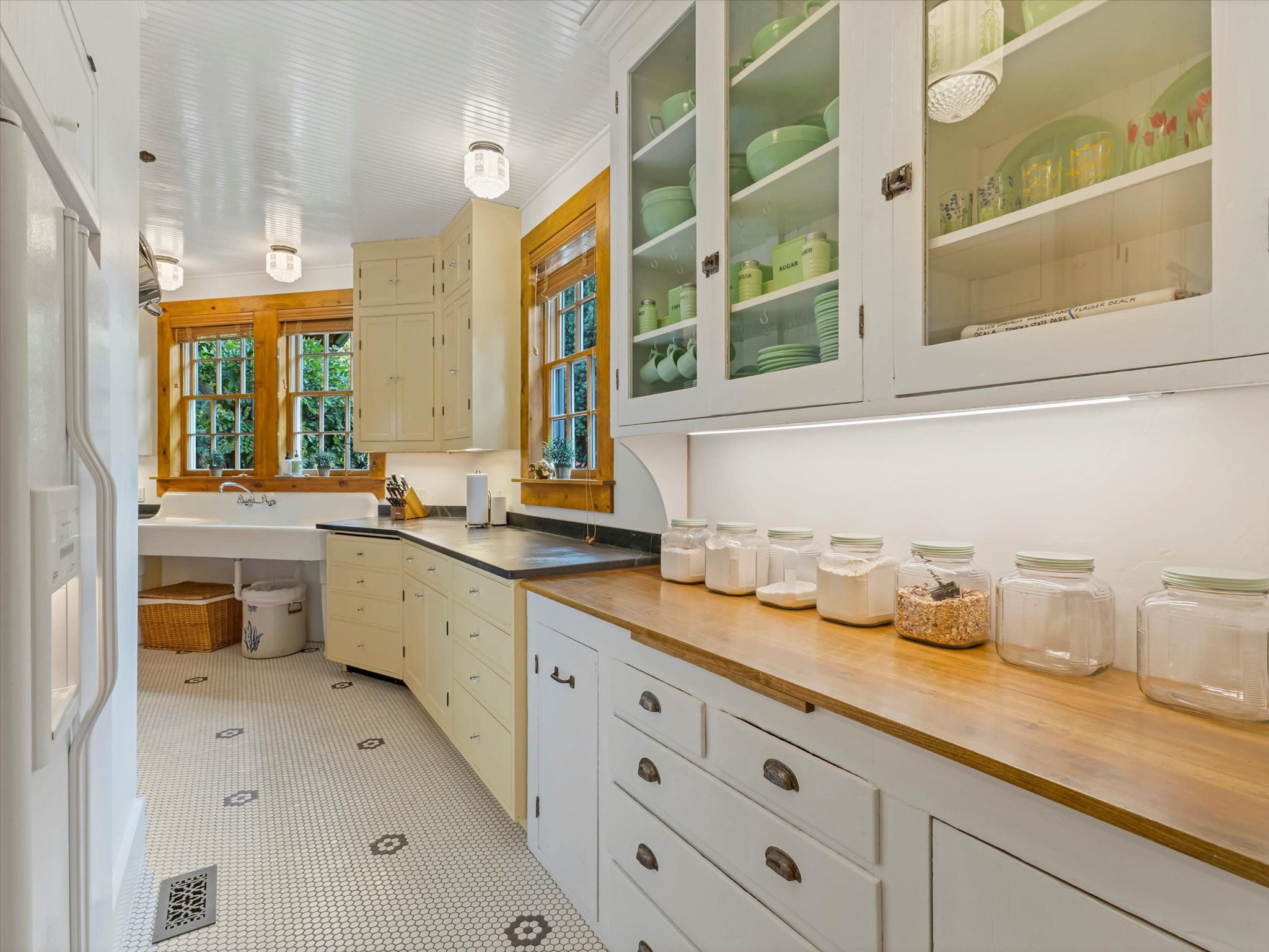 Kitchen featuring white beadboard ceiling, recessed lighting, white hex tile flooring with black accents, built-in cabinetry, and wood-finish countertops