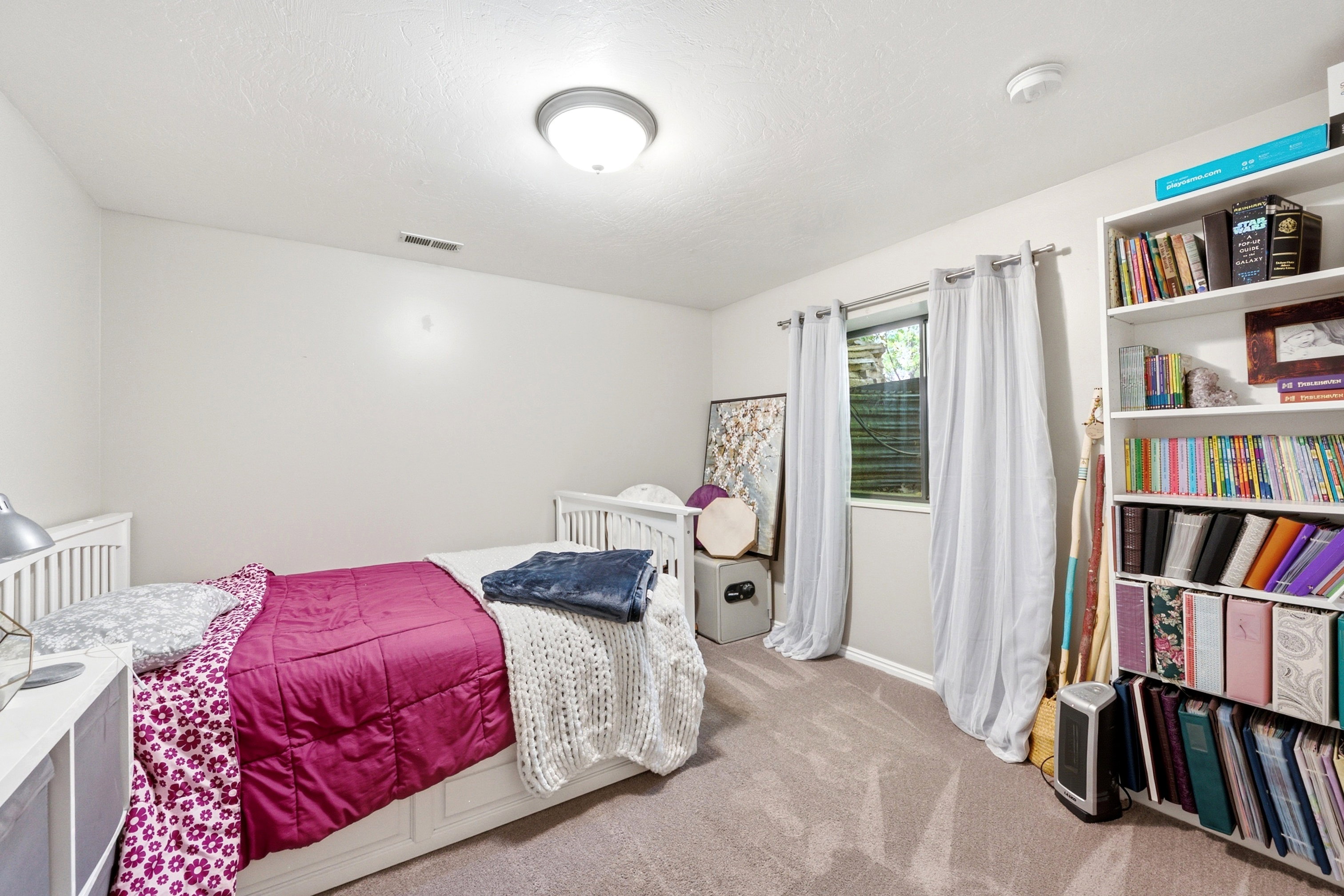 Neutral wall tones and beige carpeting establish a versatile foundation