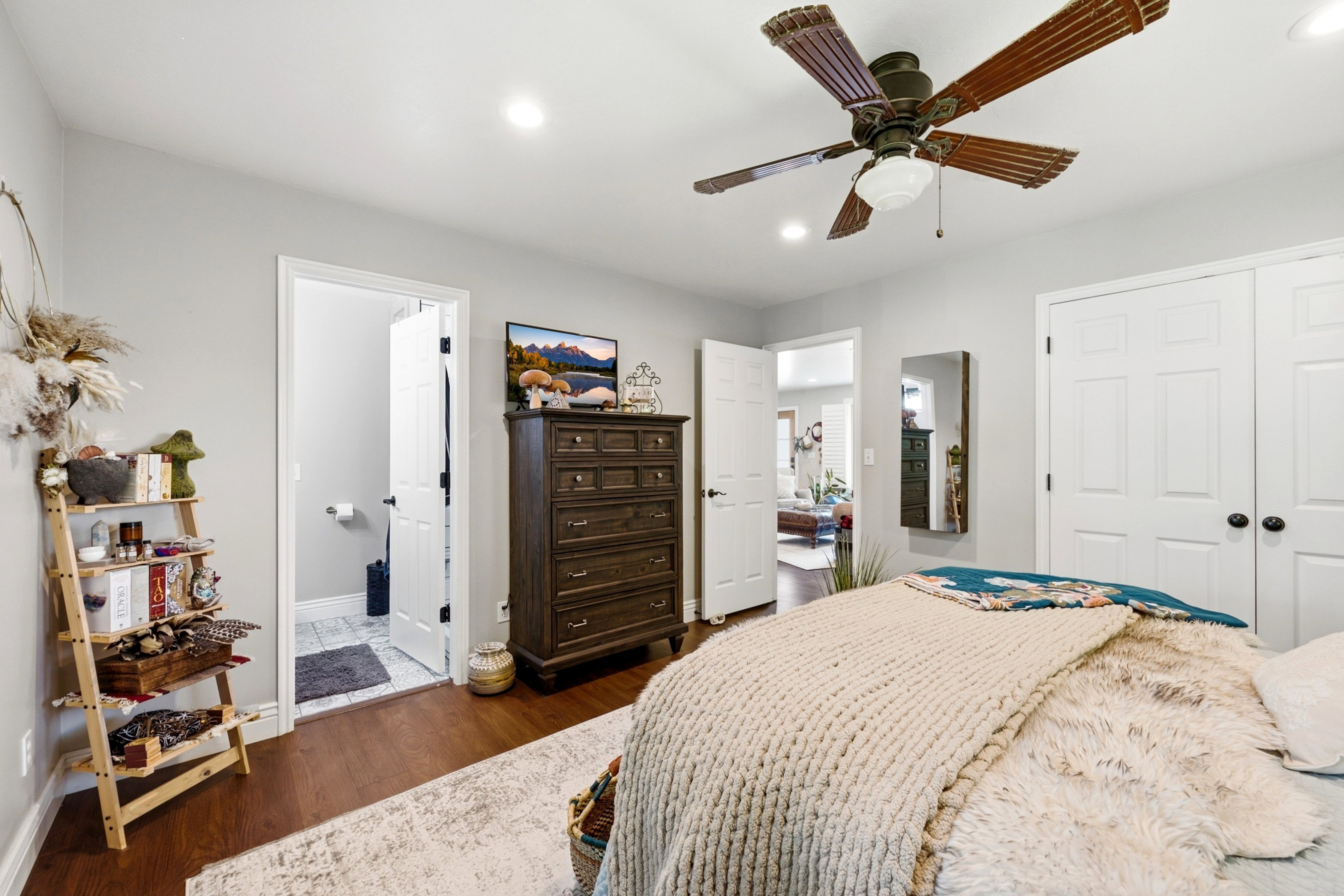 Bedroom with wood-finish flooring, recessed lighting, and a ceiling fan