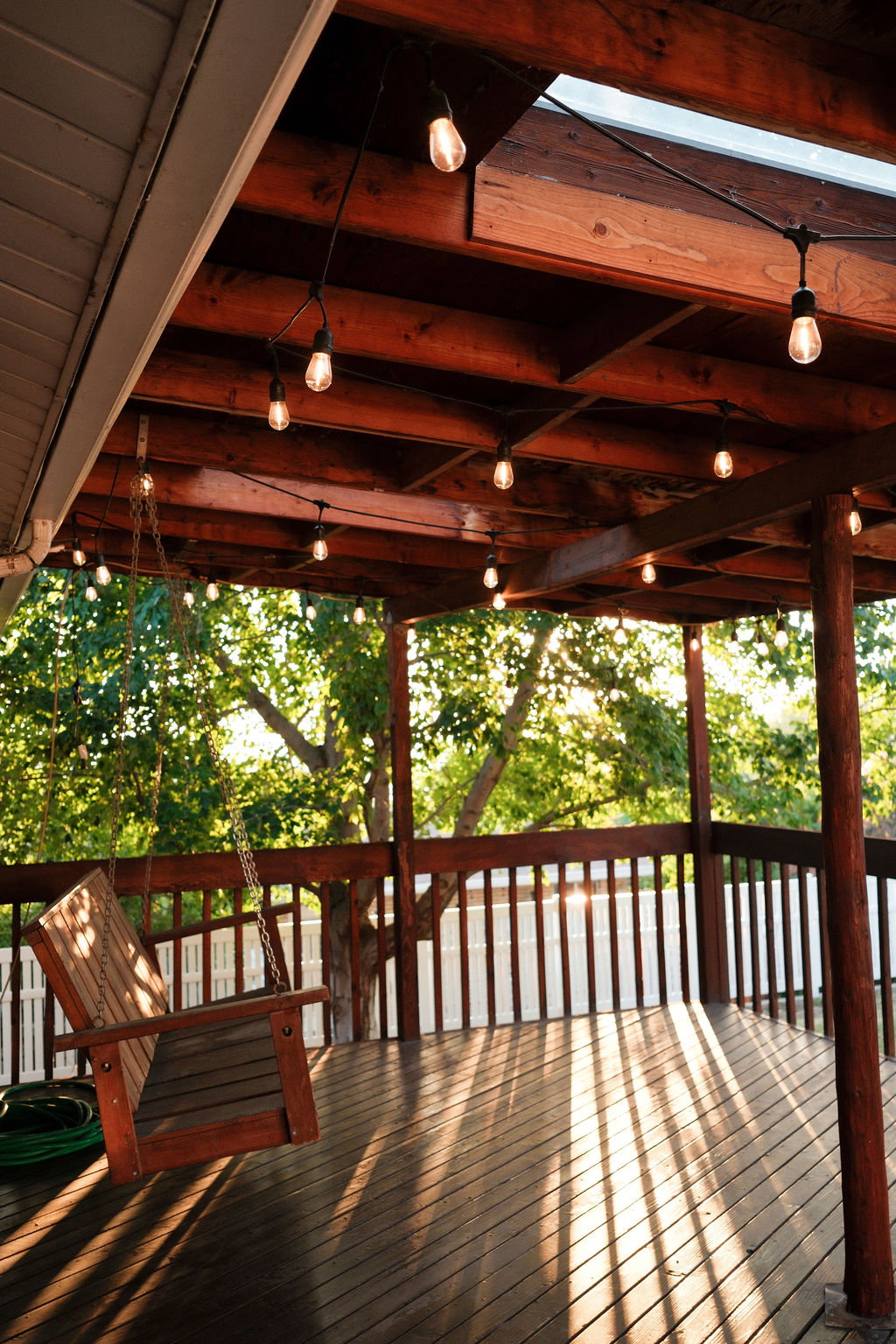 Spacious outdoor deck featuring wood-finish flooring and a wood railing
