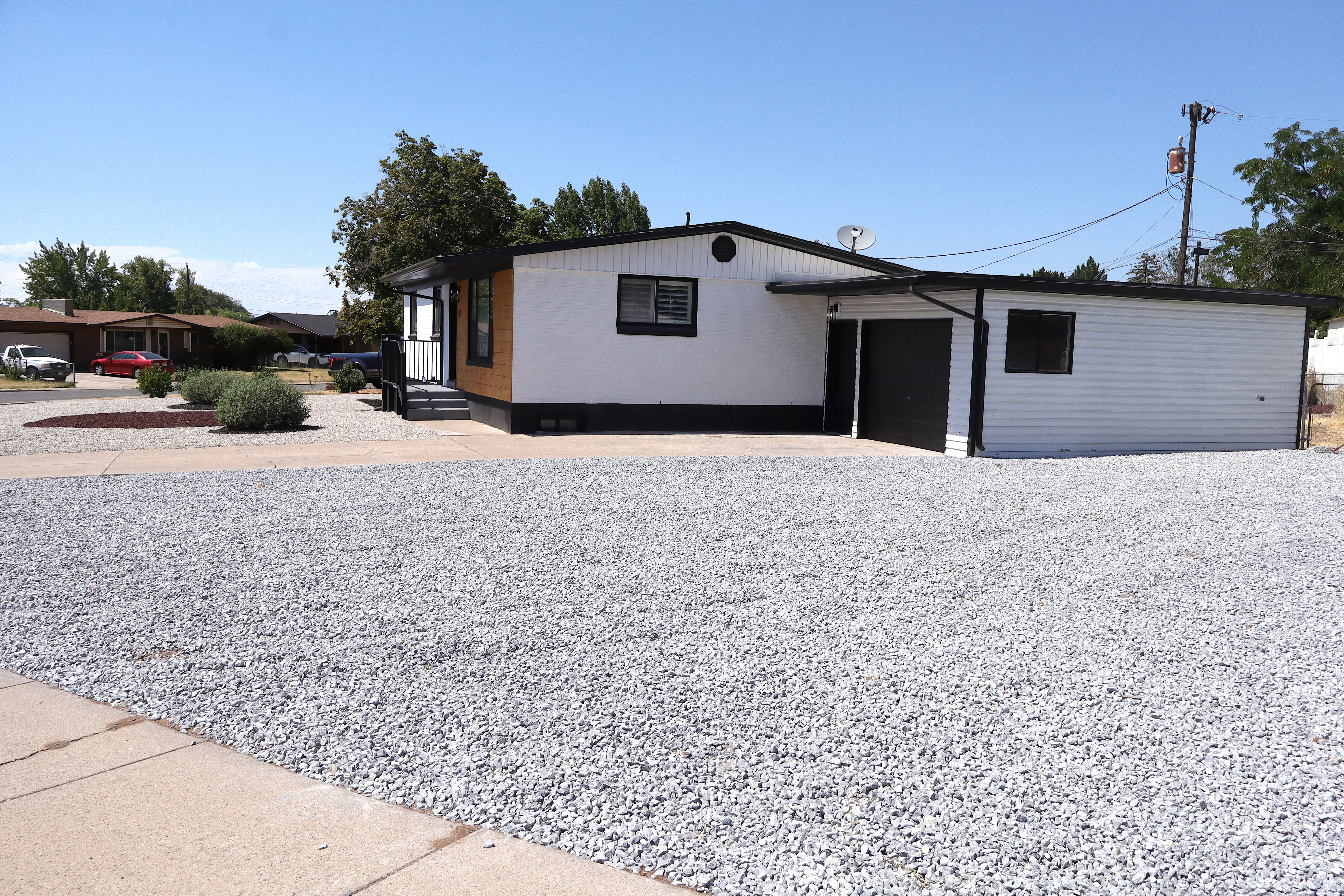 White siding exterior with black trim details