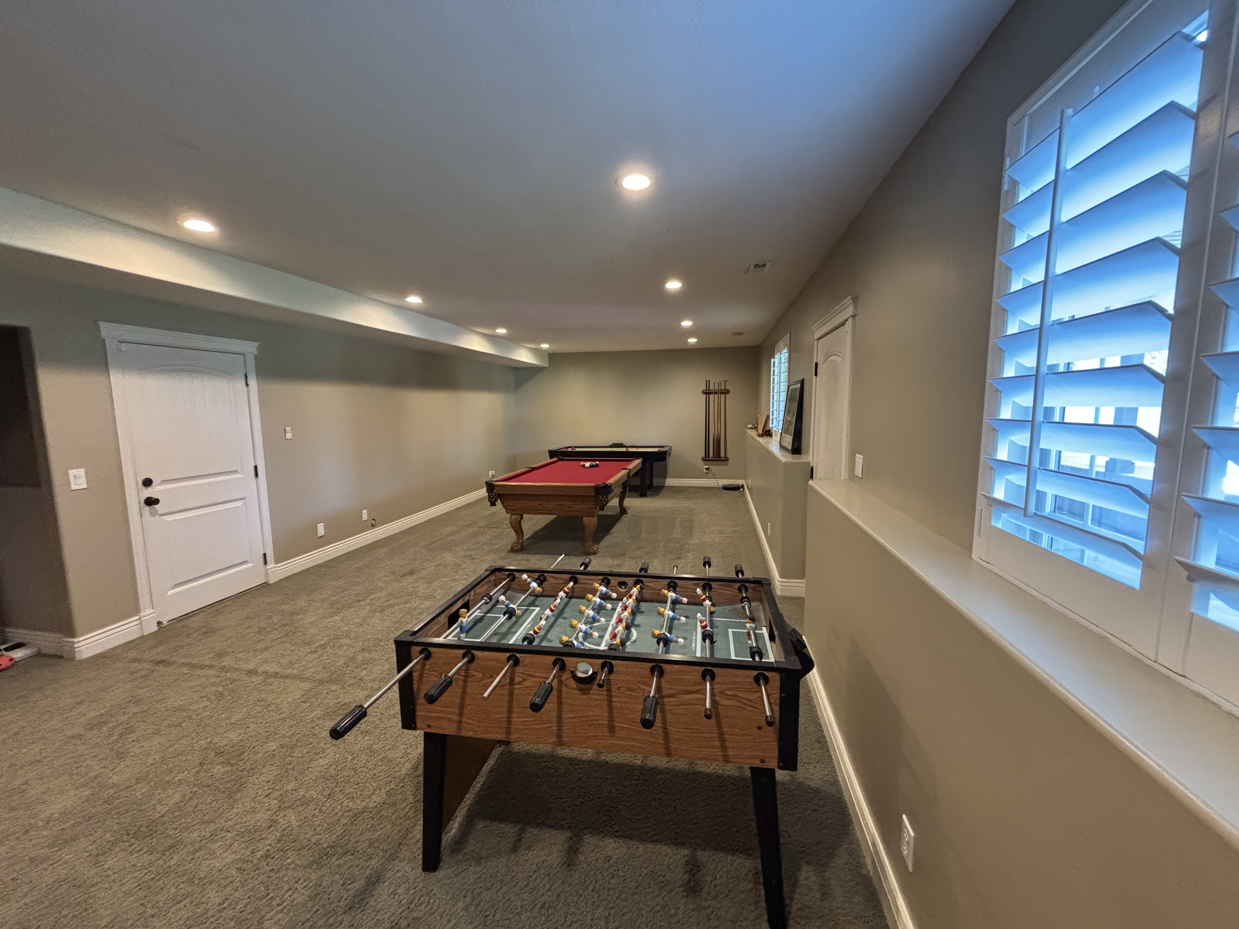 Spacious lower level featuring recessed lighting, neutral wall tones, and plush carpet flooring