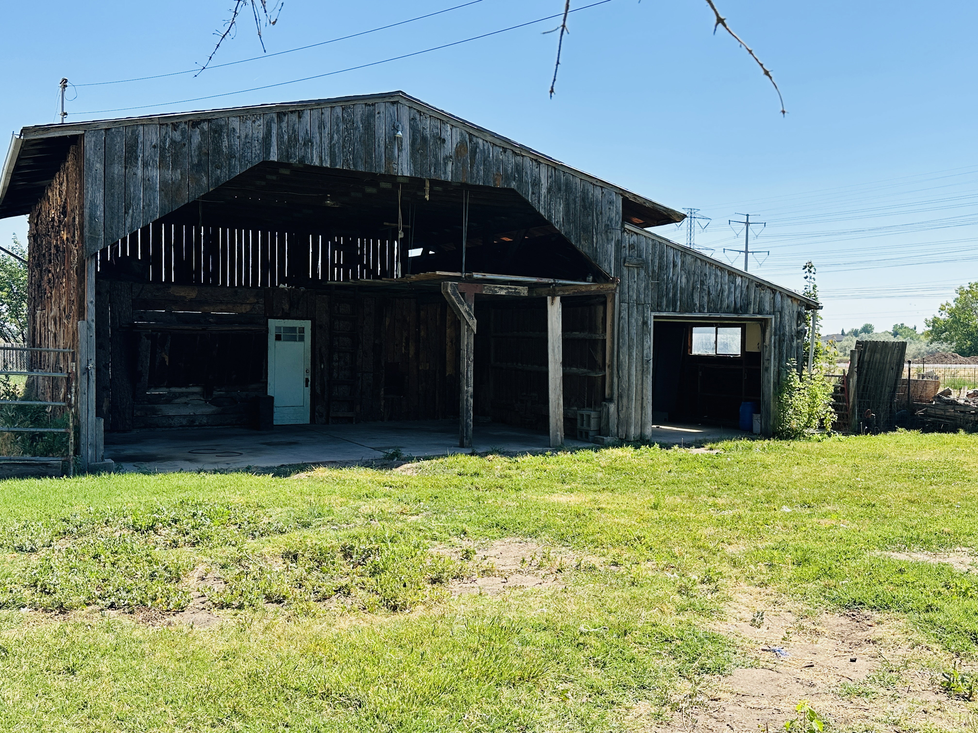 Rustic barn structure featuring a gabled roof and weathered wood siding