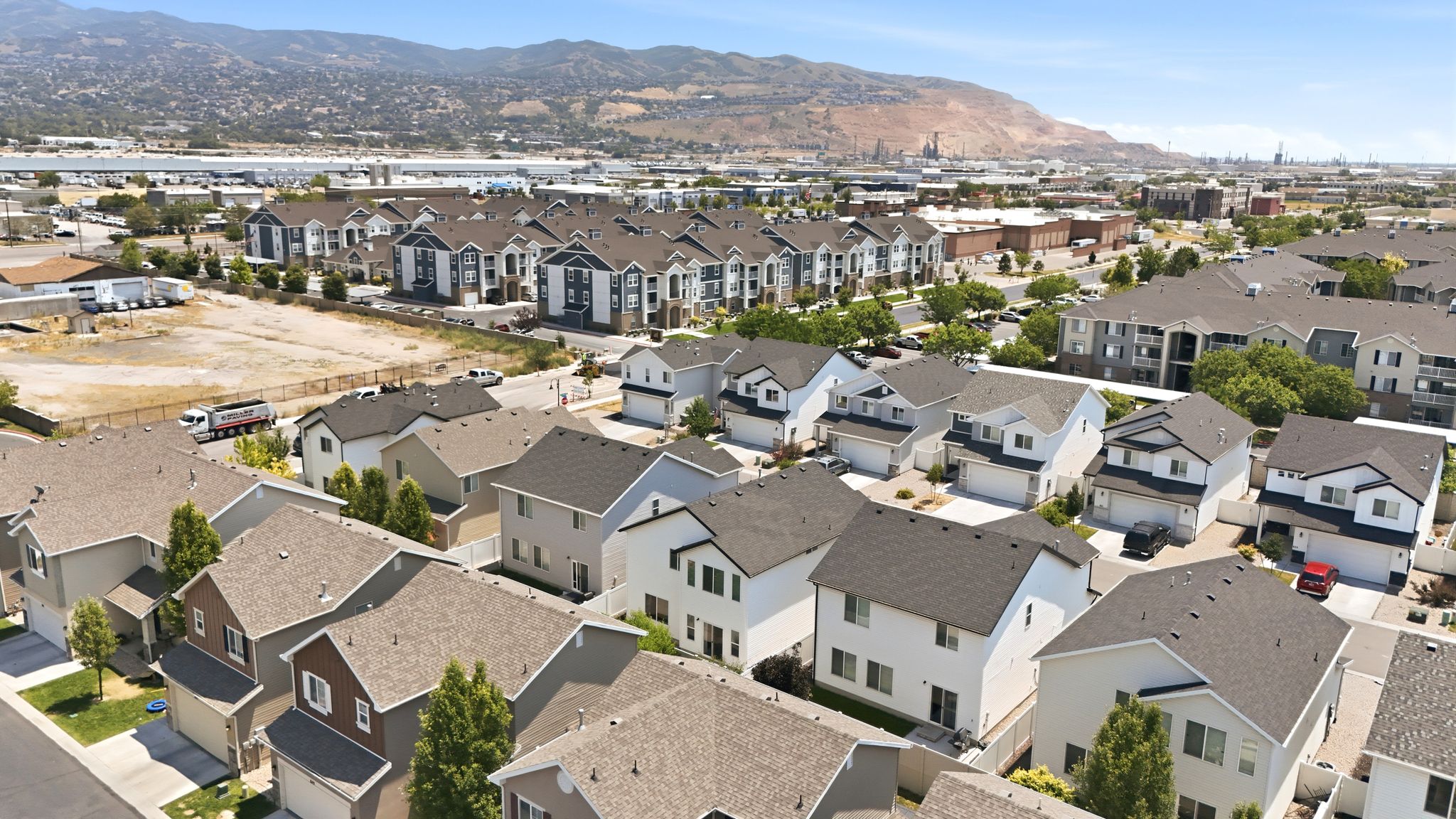 Residential neighborhood featuring a mix of single-family homes and multi-story apartment buildings