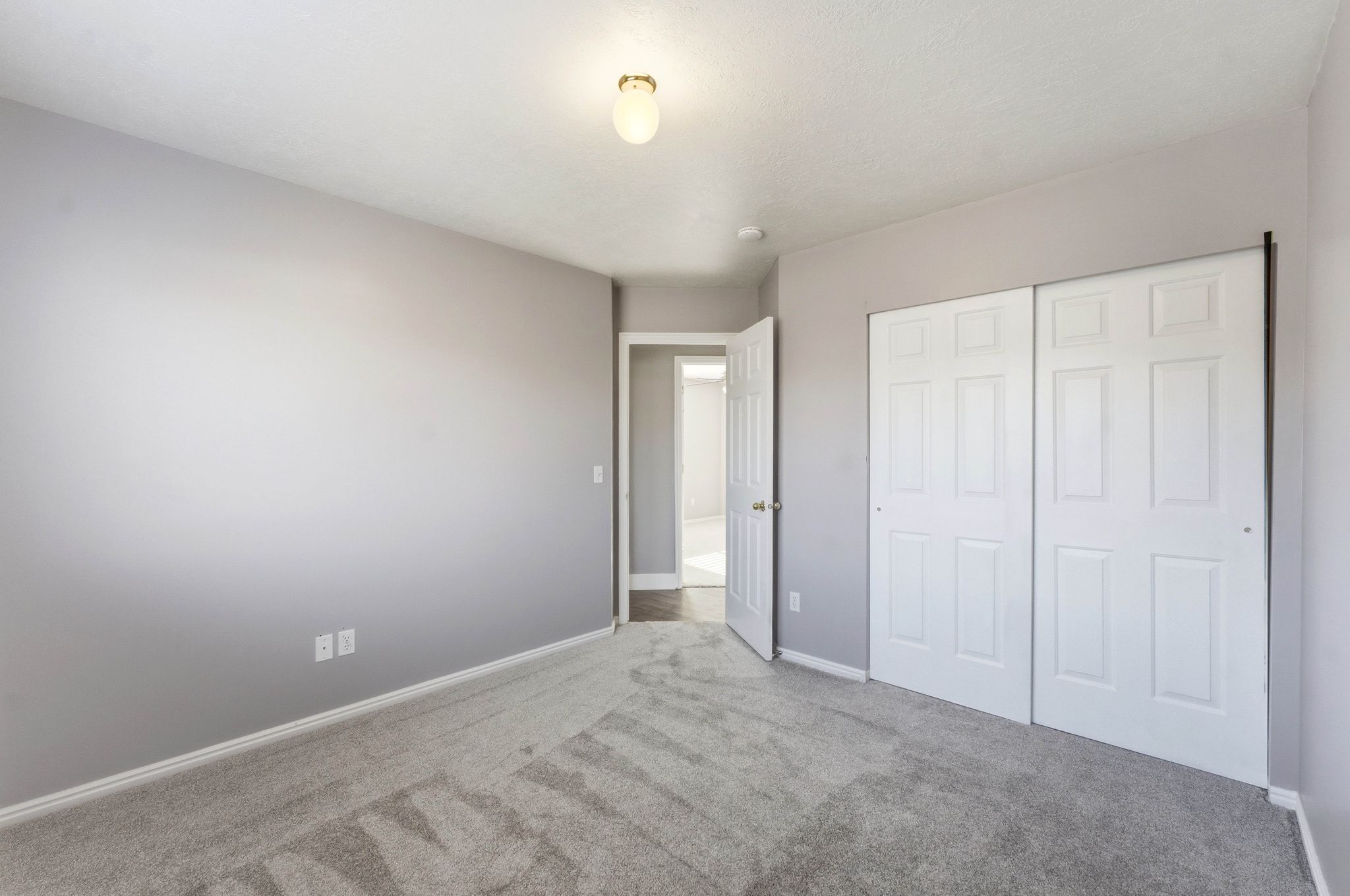Wall-to-wall carpeting and neutral wall tones