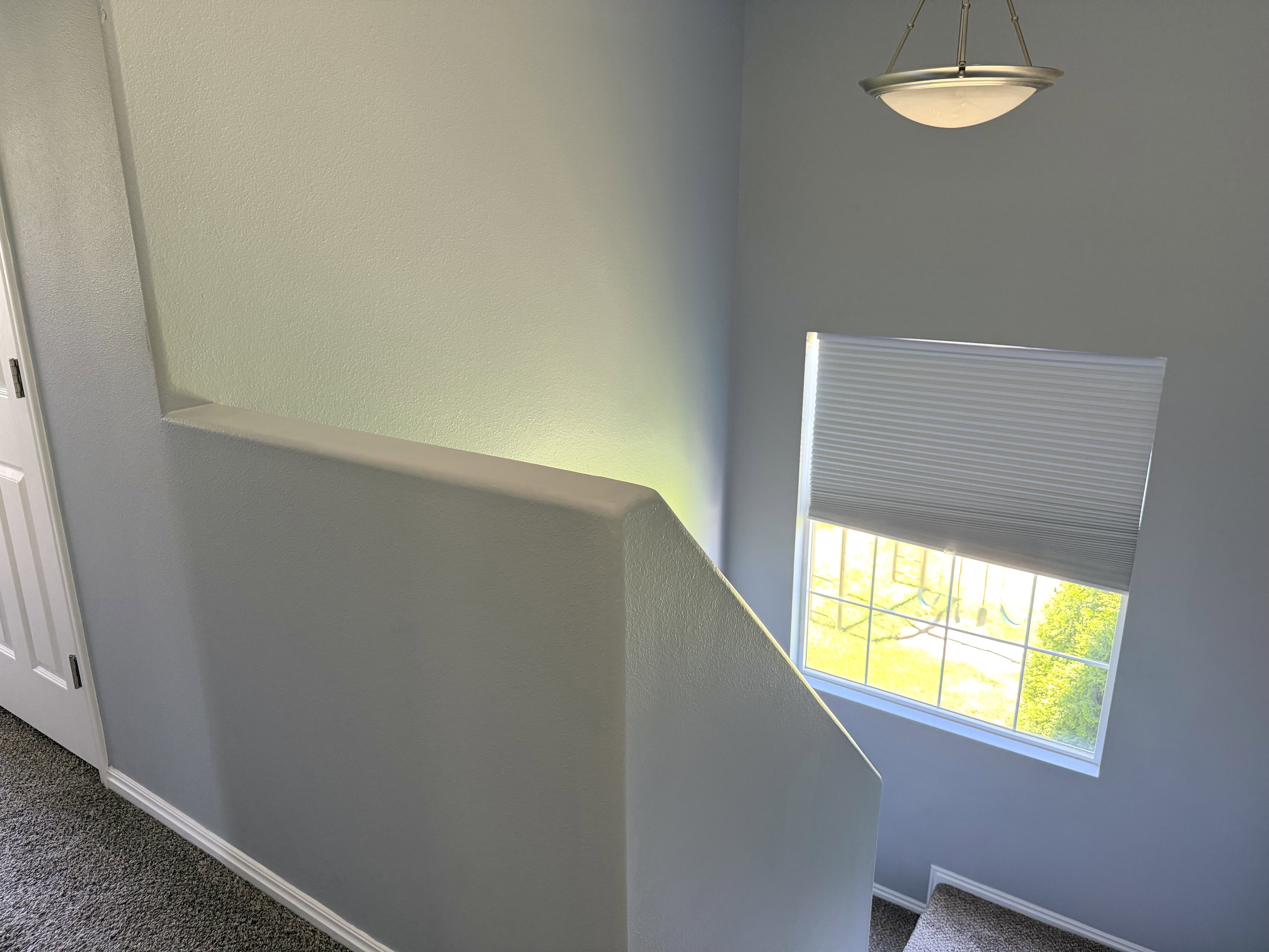 Window with horizontal muntins and cellular shade