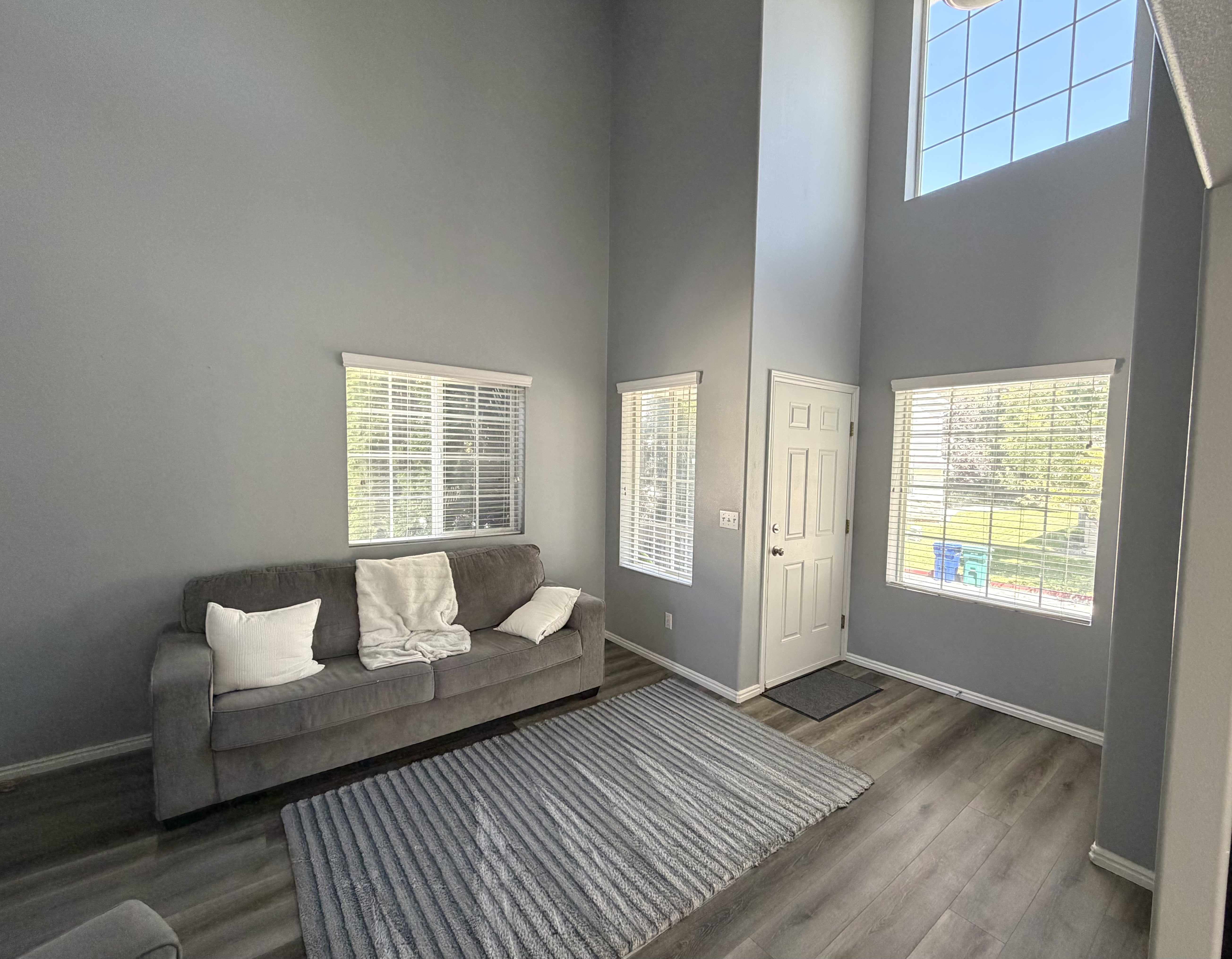 Vaulted ceilings and abundant natural light highlight this living space