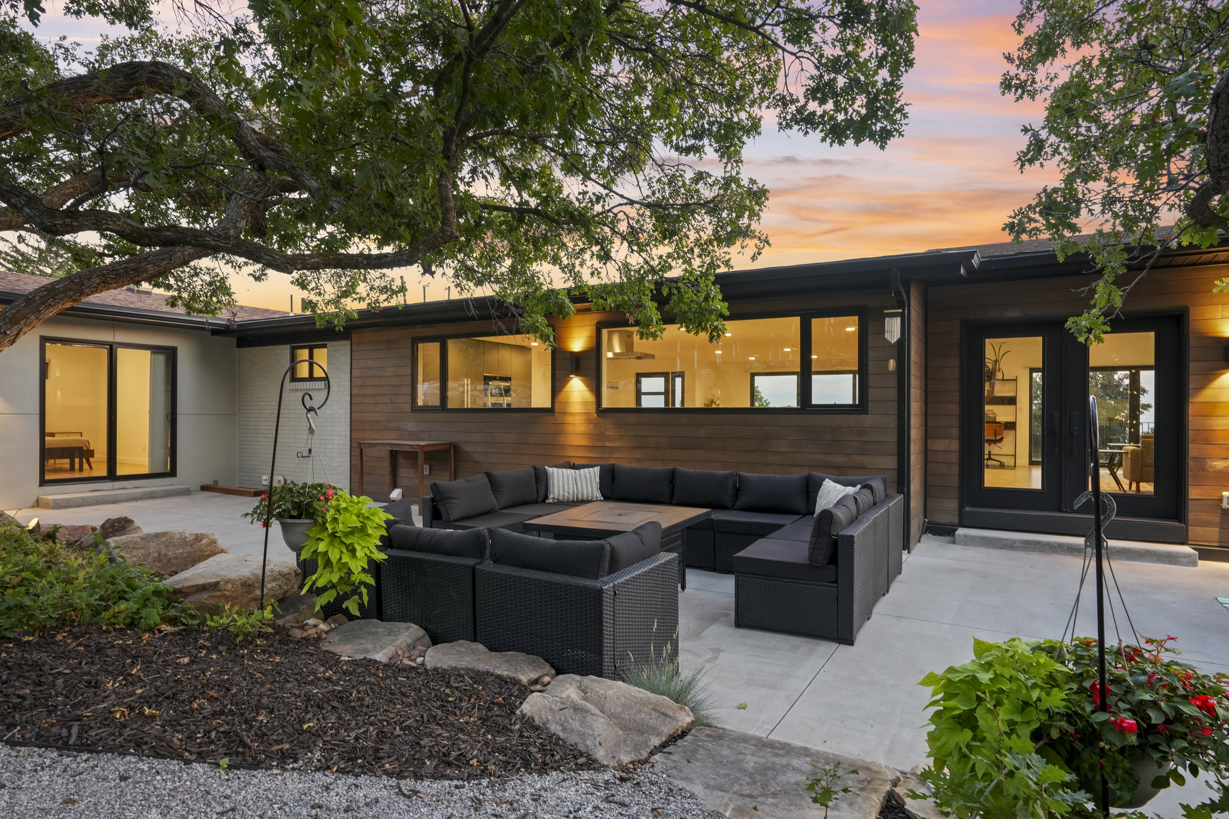 Expansive concrete patio area with a built-in sectional seating arrangement