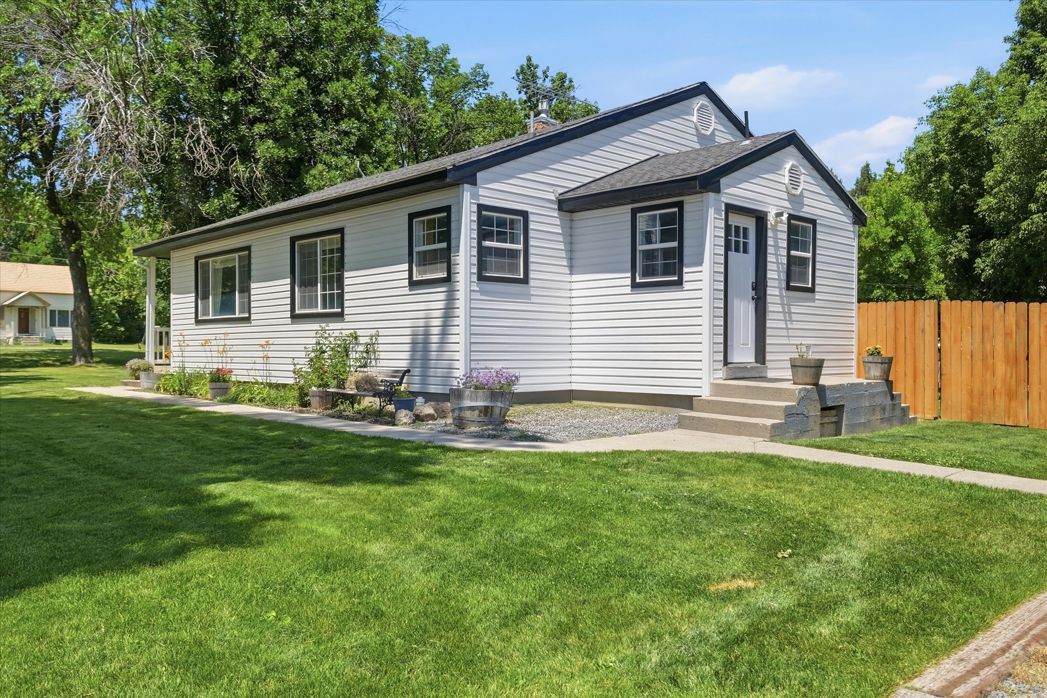 White horizontal siding exterior with black trim windows