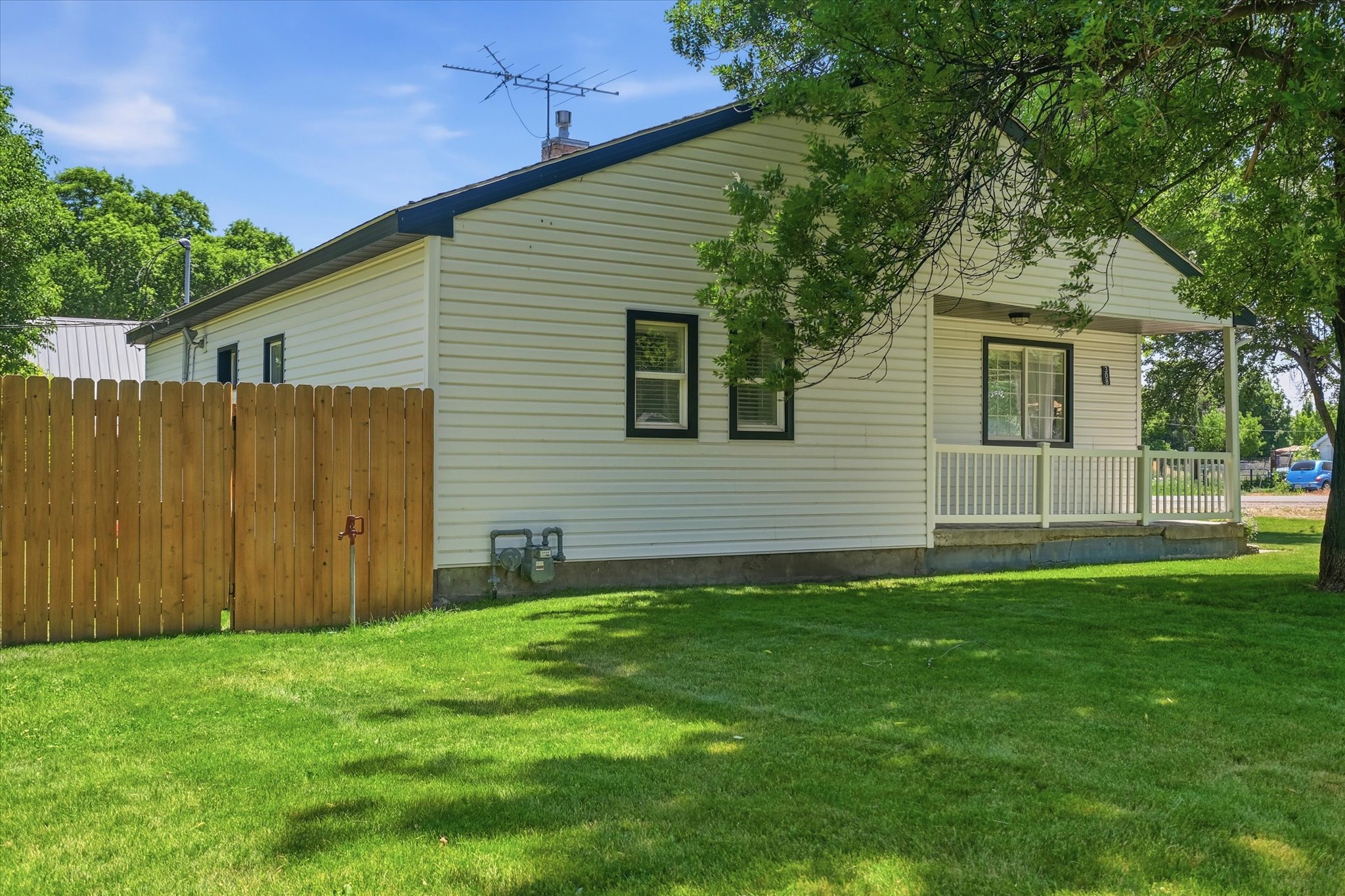 White siding exterior with black trim windows