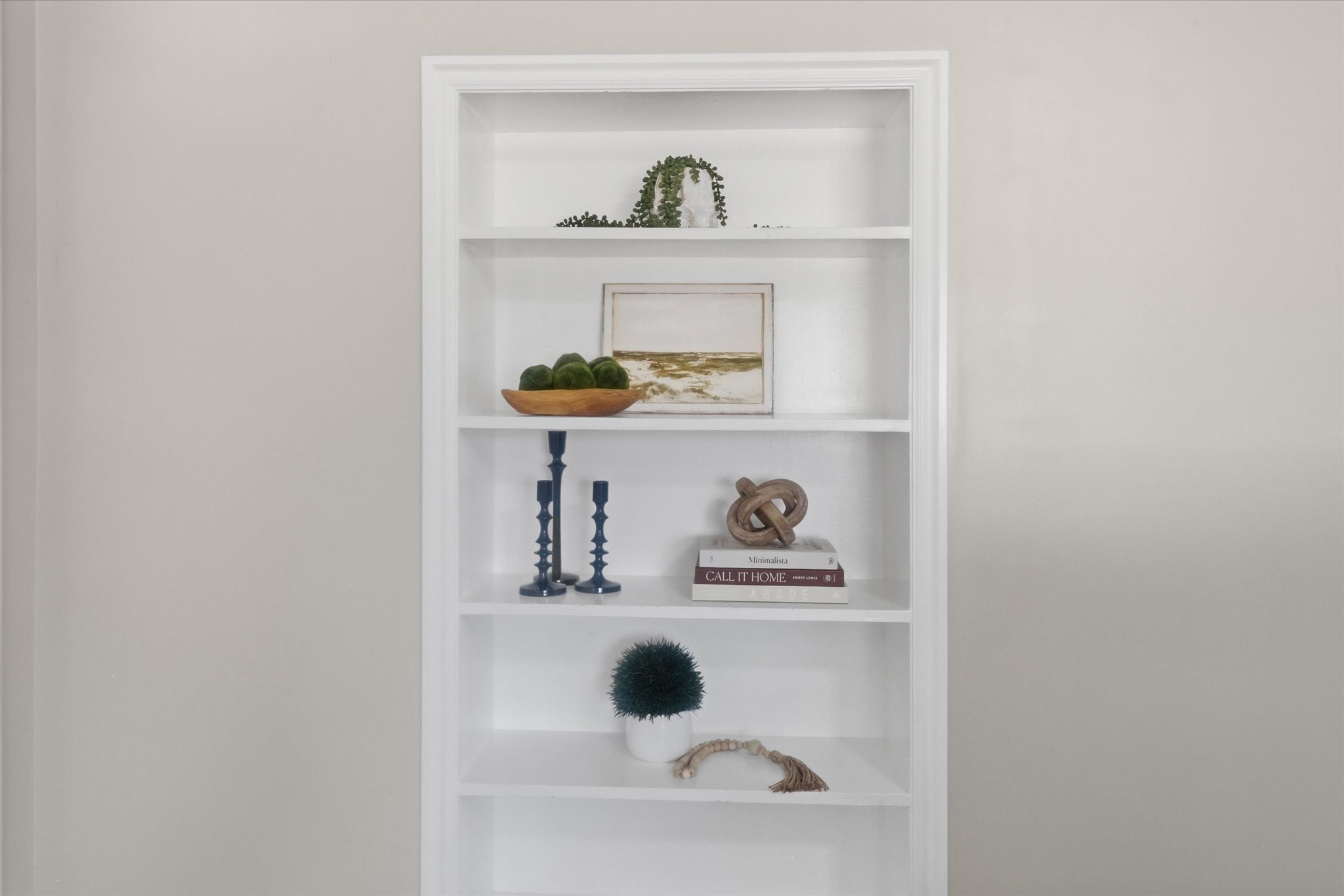 Built-in shelving unit with white finish
