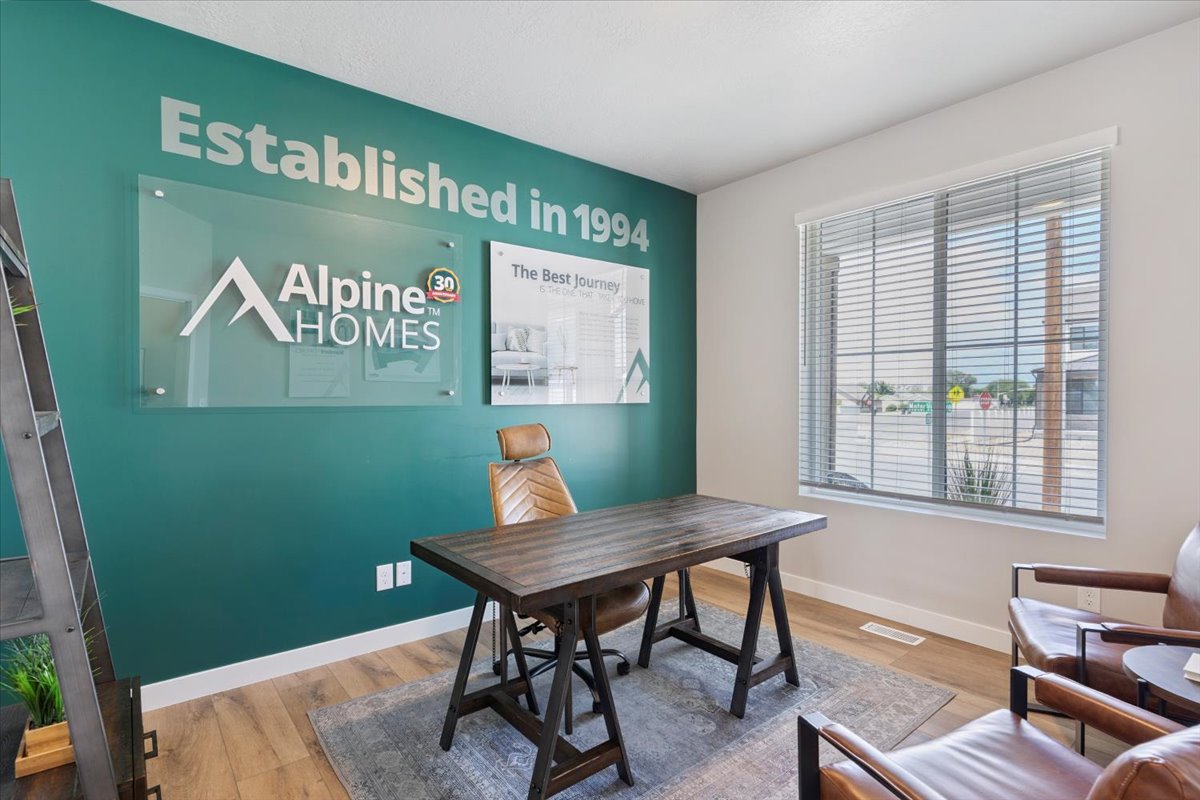 Interior space featuring a deep teal accent wall, wood-finish flooring, and a large window with blinds