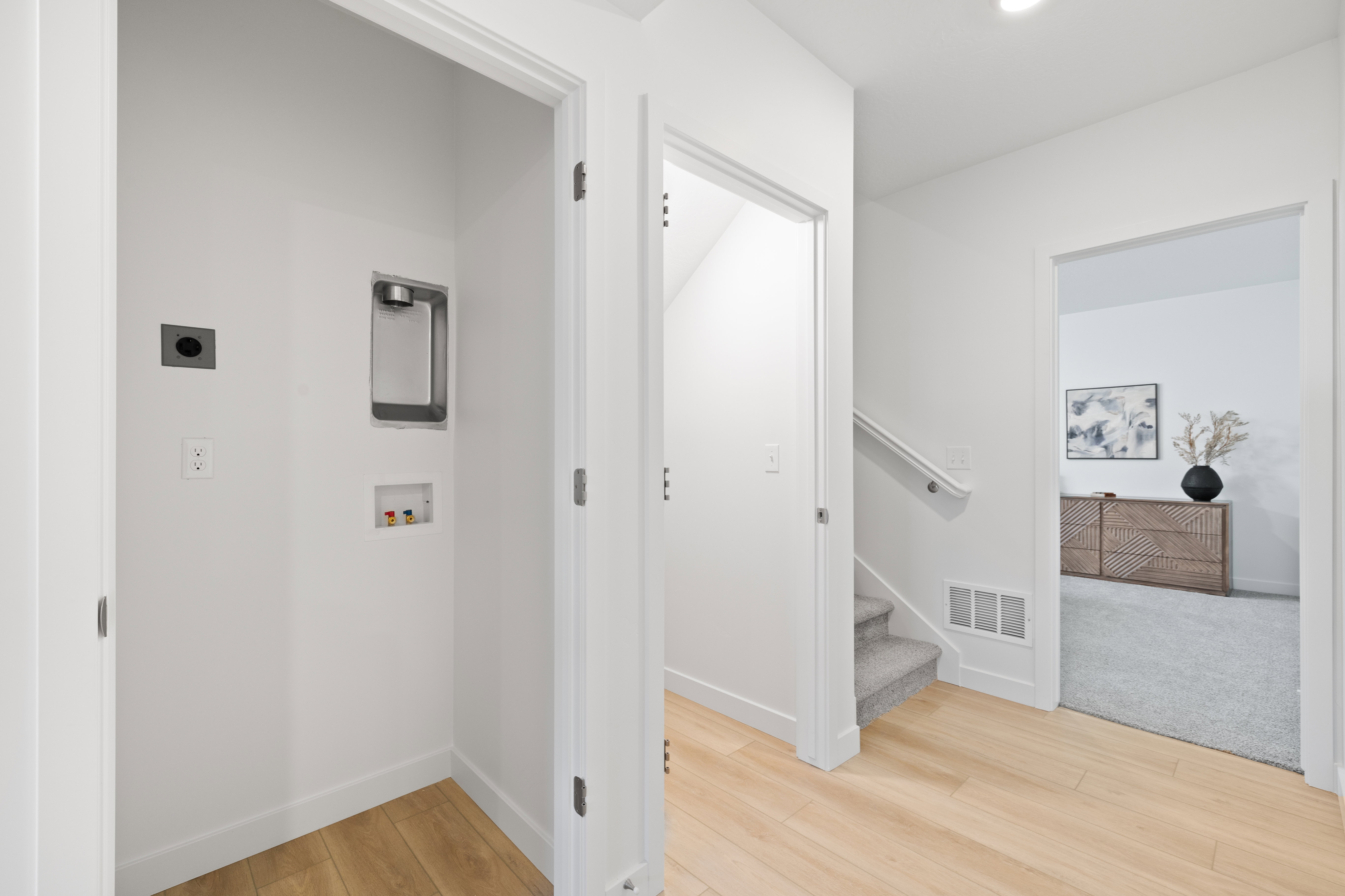 Dedicated laundry area featuring a wall-mounted utility box and connections