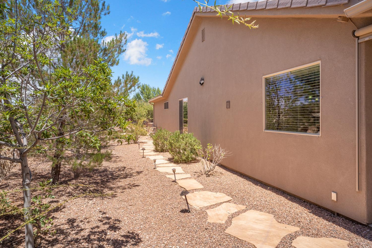 Stucco exterior with a tiled roofline