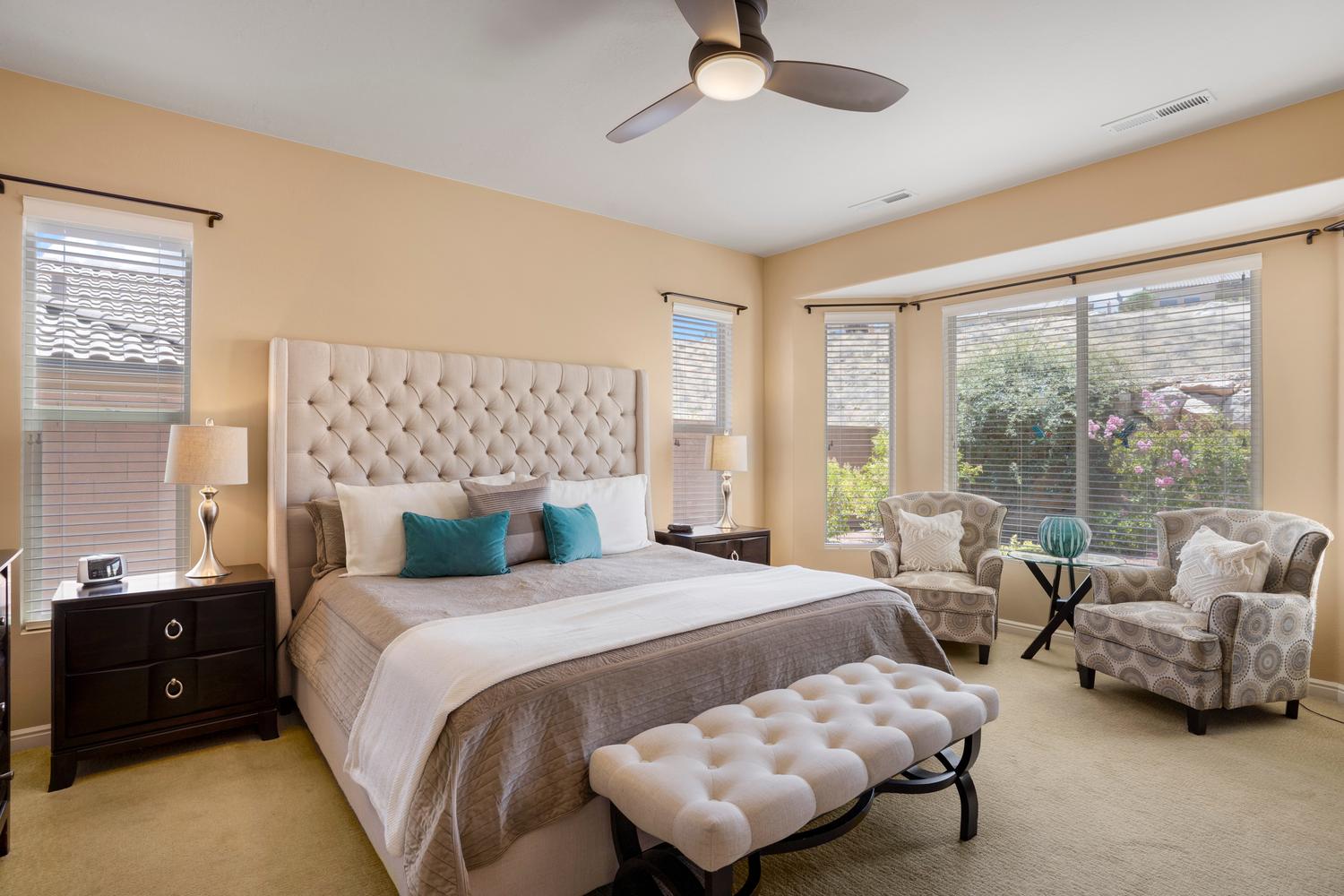 Spacious room featuring a bay window, recessed lighting, and a ceiling fan