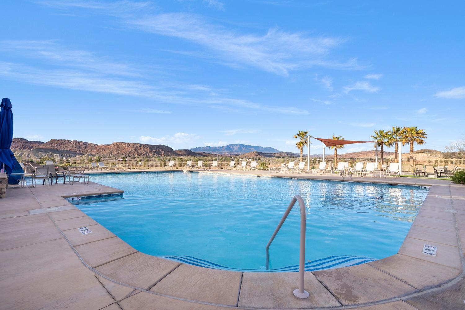Expansive outdoor pool with a concrete deck surround
