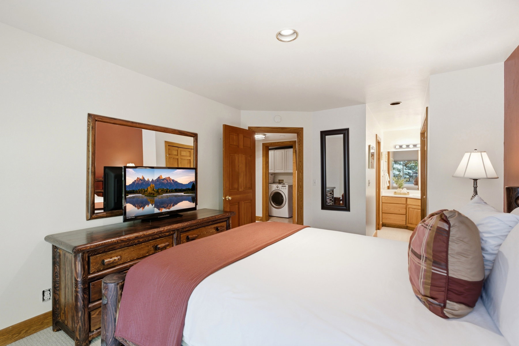 Bedroom featuring wood-finish flooring, recessed lighting, and a built-in wood dresser