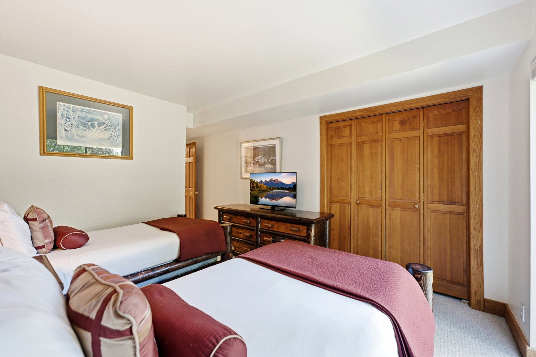 Light-colored carpeting complementing white walls