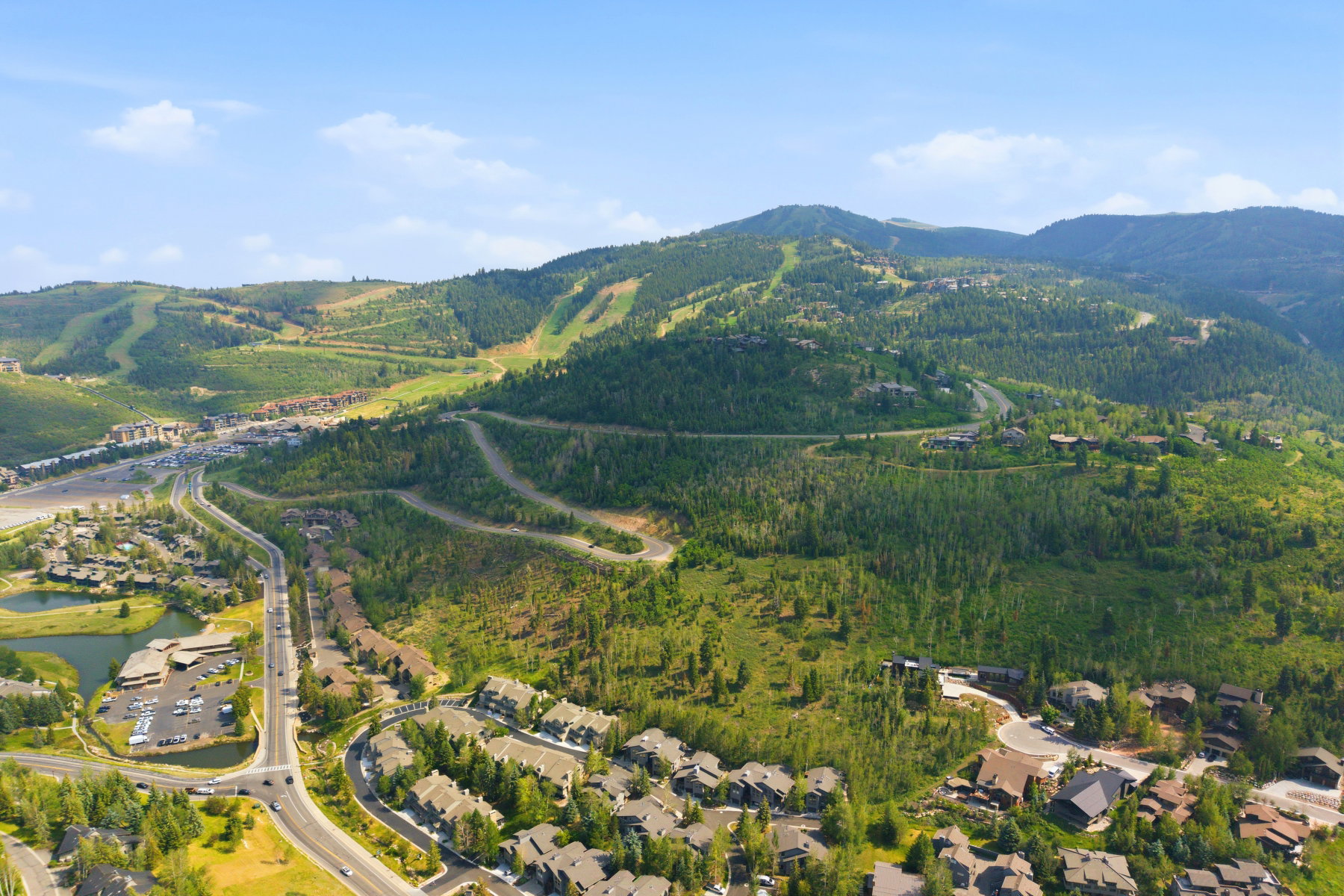 Aerial perspective showcasing mountainous terrain with residential properties