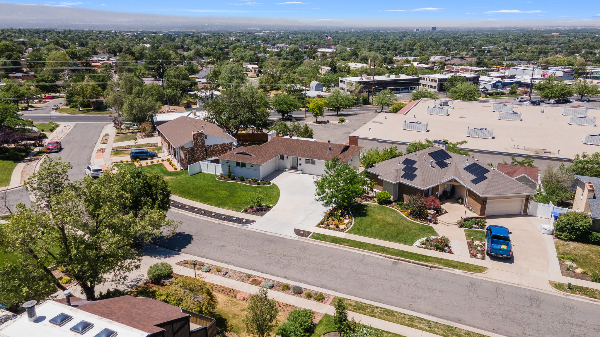 Ranch-style residence featuring a brick and siding exterior, an attached garage, and a concrete driveway
