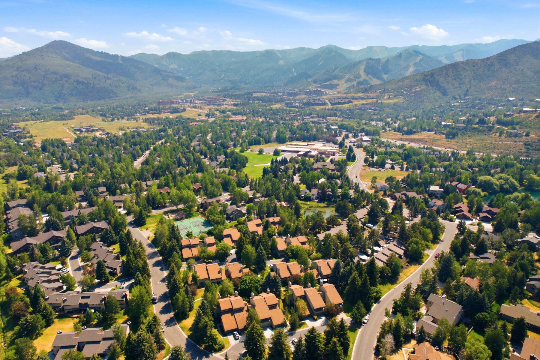 Sprawling residential development set against a mountainous backdrop
