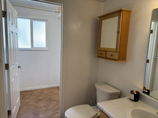 1/2 bath with laundry room.  Tiled flooring and a window