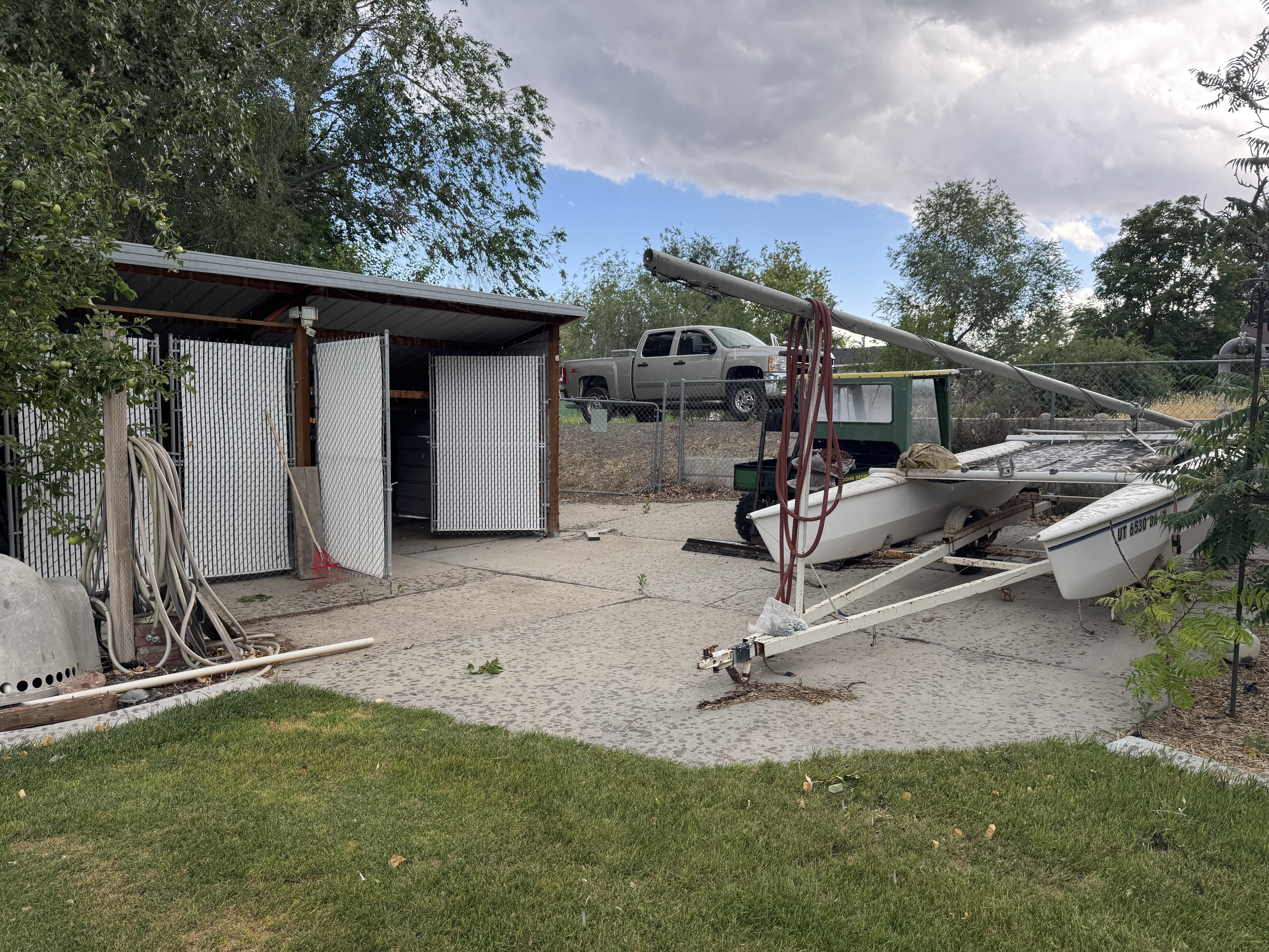 Storage structure featuring a metal roof and slatted metal doors