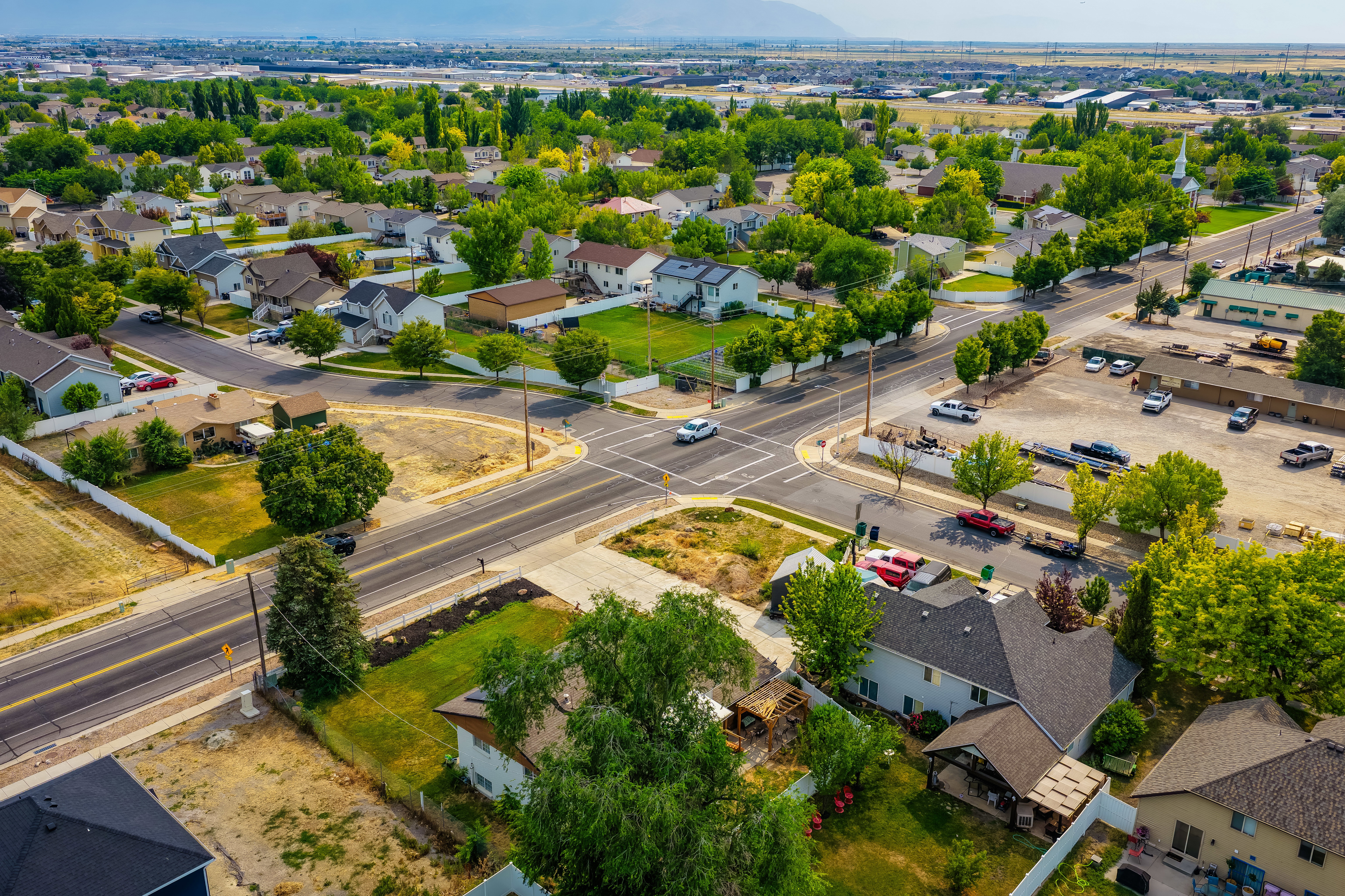 Aerial view of a residential neighborhood with established homes and mature trees