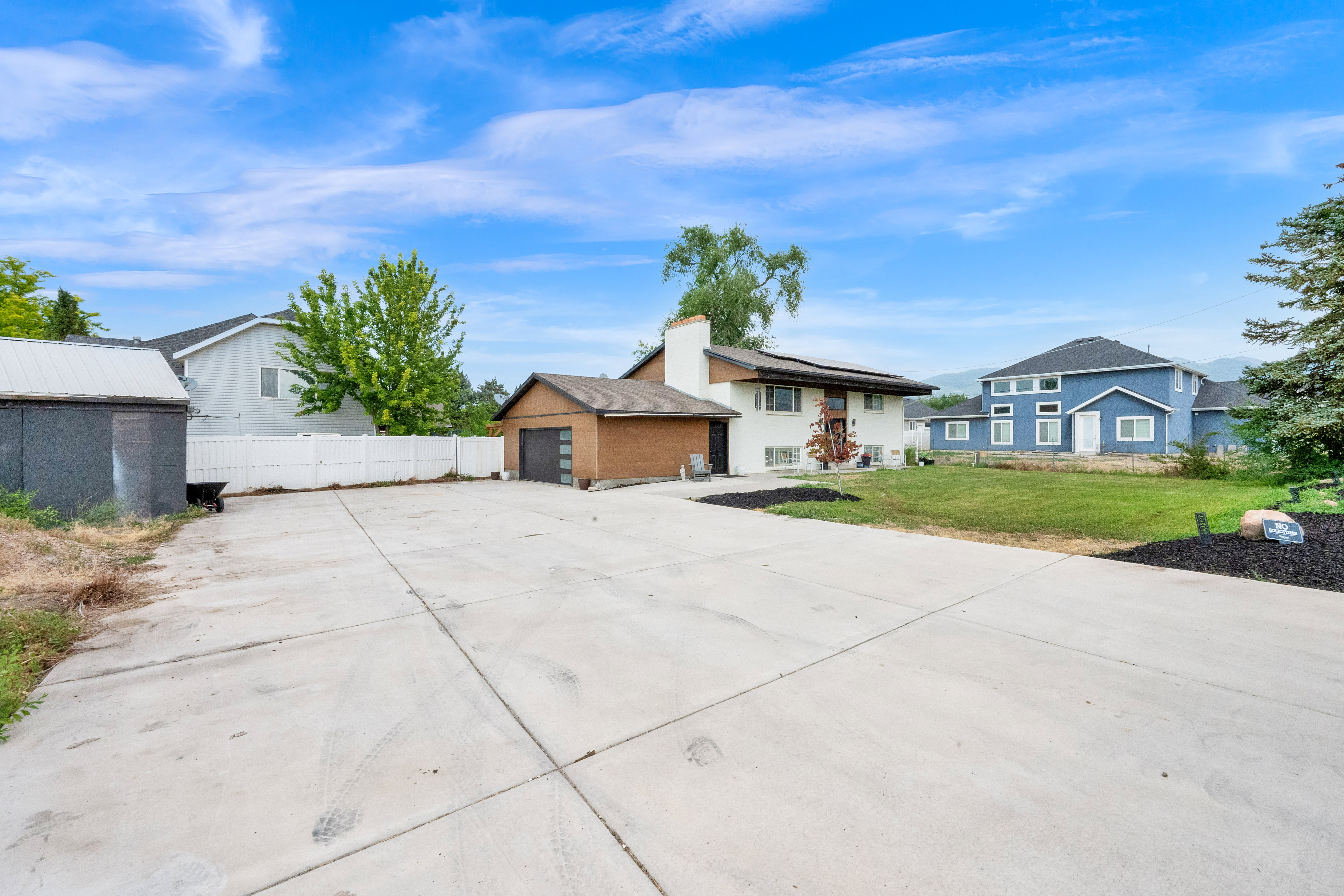 Expansive concrete driveway and parking area