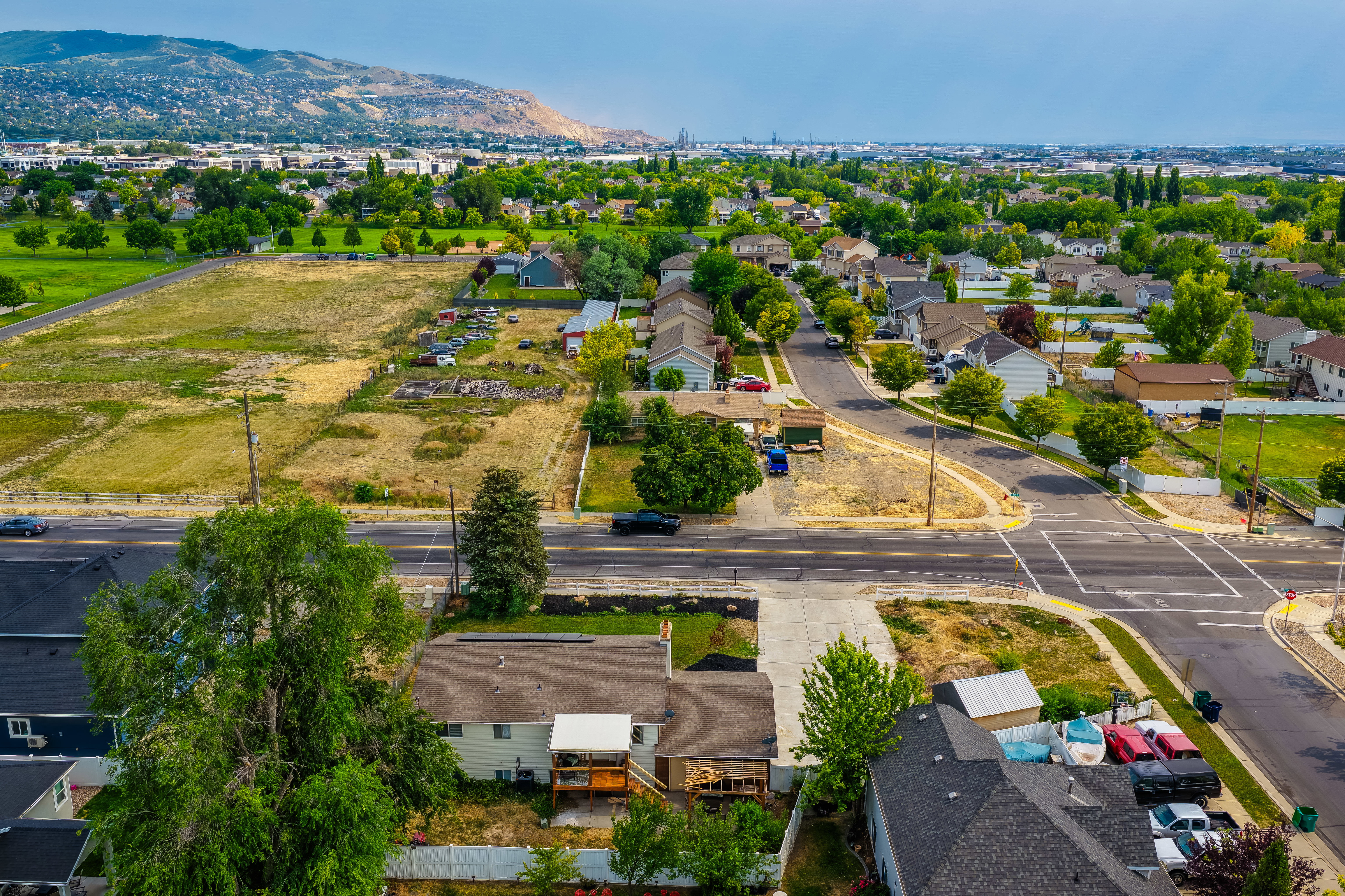 Residential neighborhood featuring established homes, mature trees, and paved roads