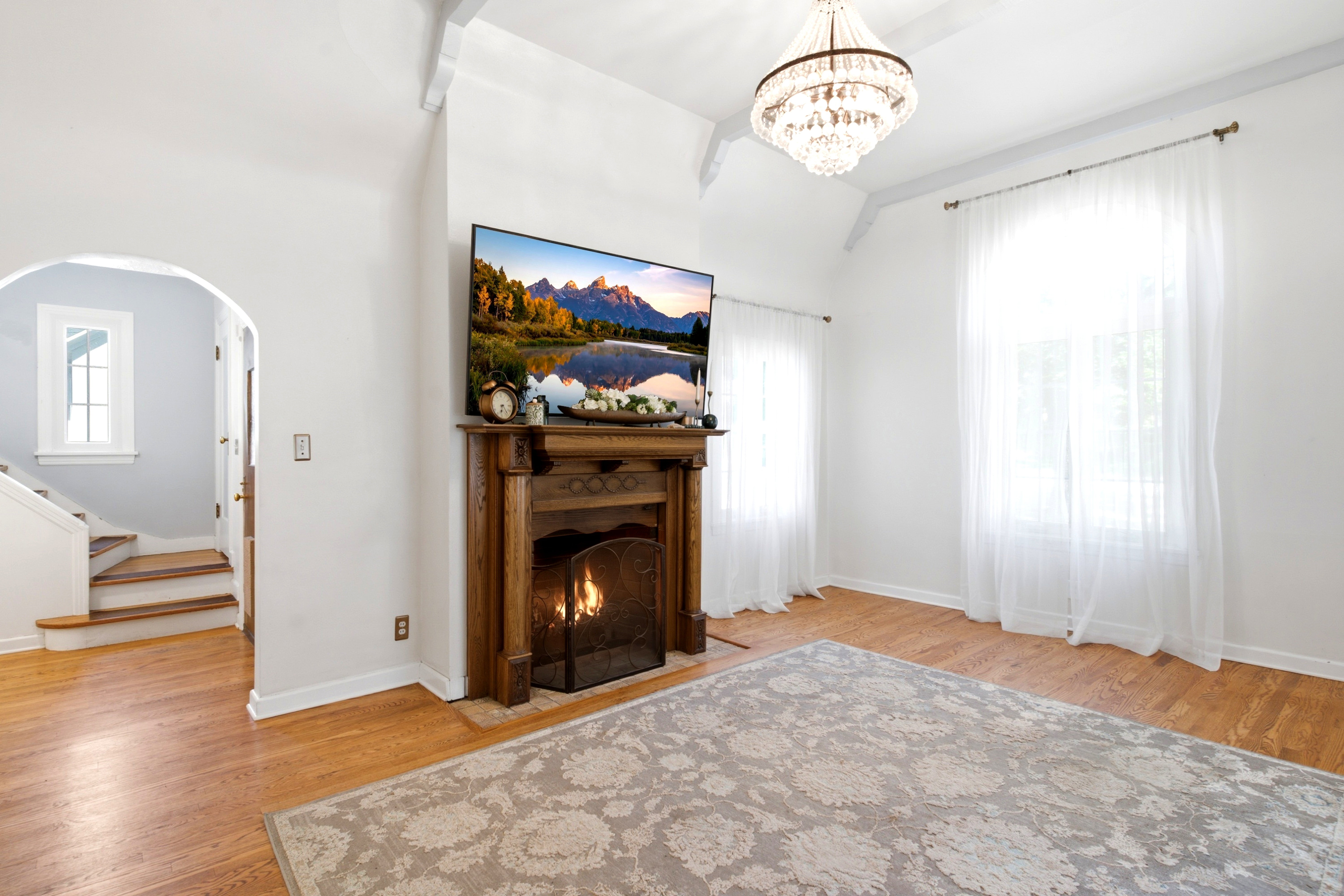 Living area featuring the classical ornament wood mantel fireplace.