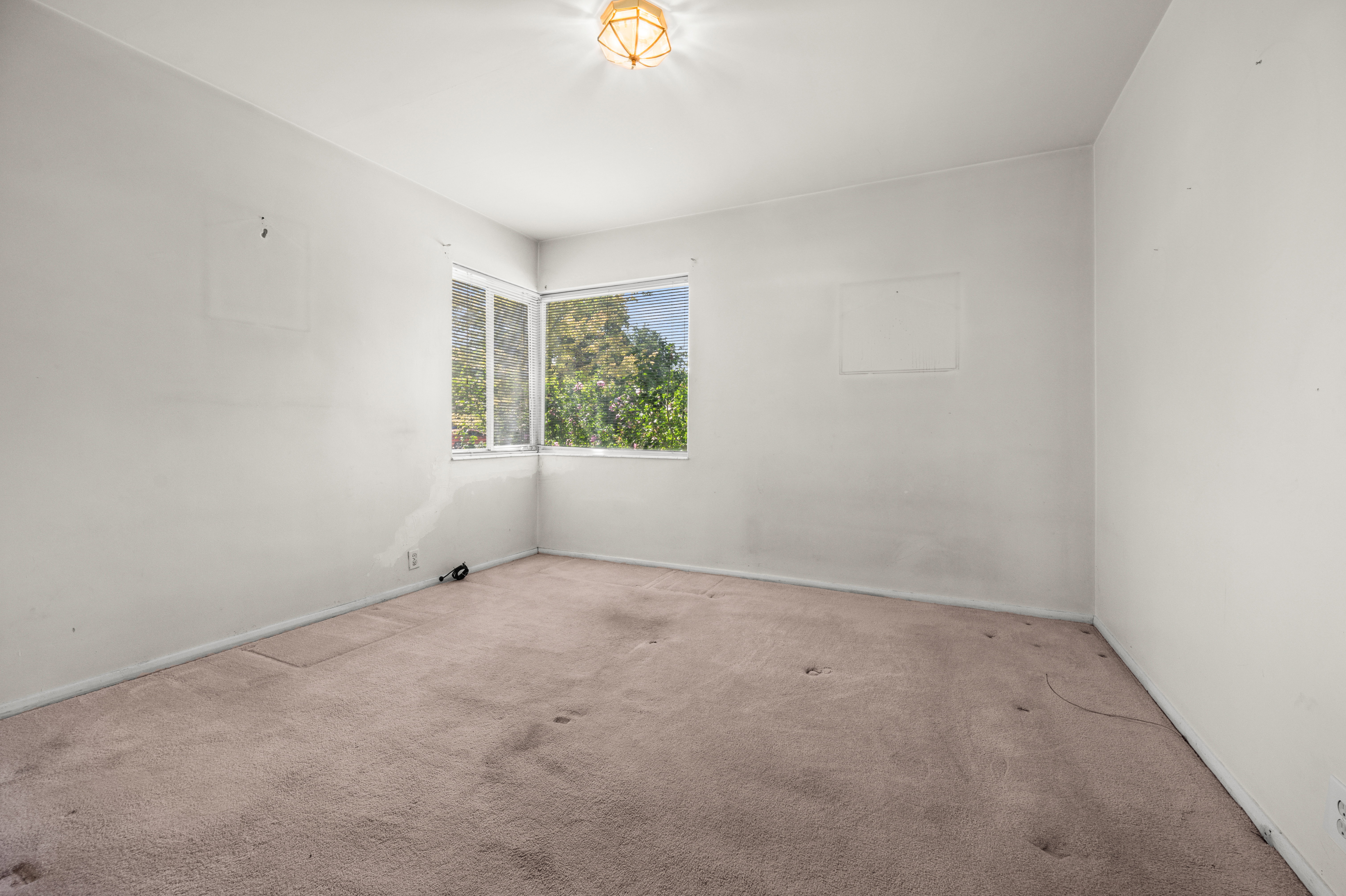 Room featuring neutral-toned carpeting and white painted walls