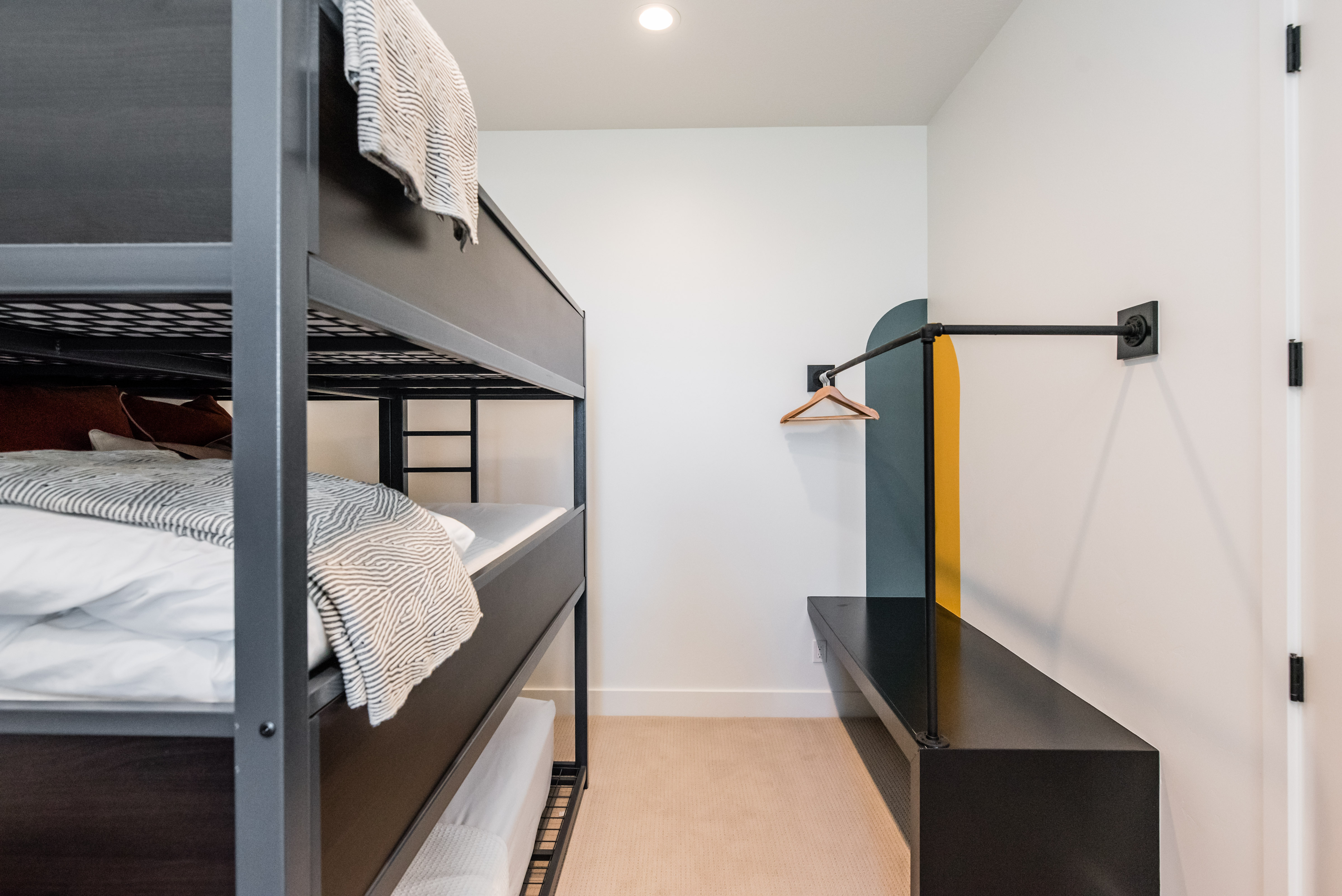 Contemporary bunk beds featuring a matte black metal frame