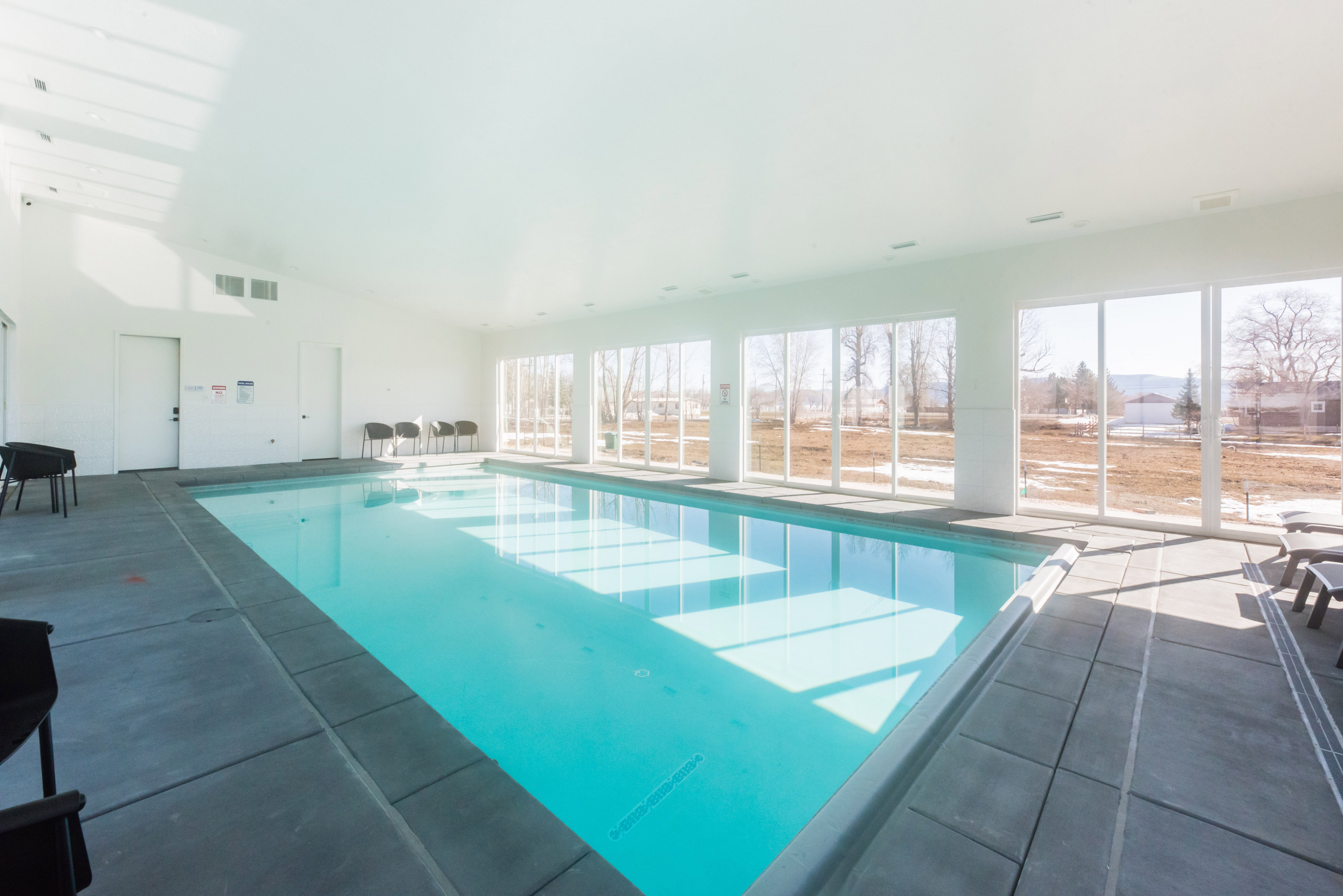 Indoor swimming pool with concrete surround