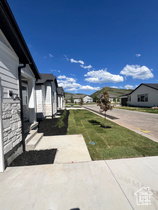 Modern residential exterior featuring horizontal siding and stone veneer accents