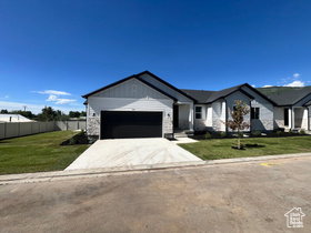 Contemporary exterior with white siding and gray stone accents