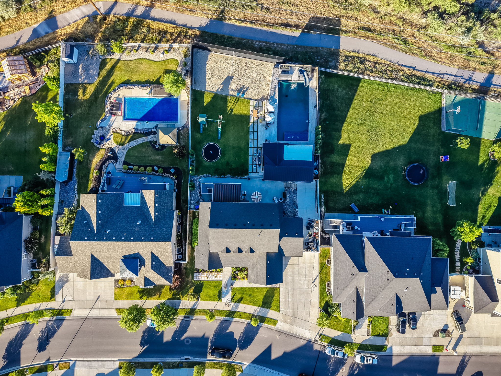 Aerial view showcasing multiple properties with extensive outdoor amenities