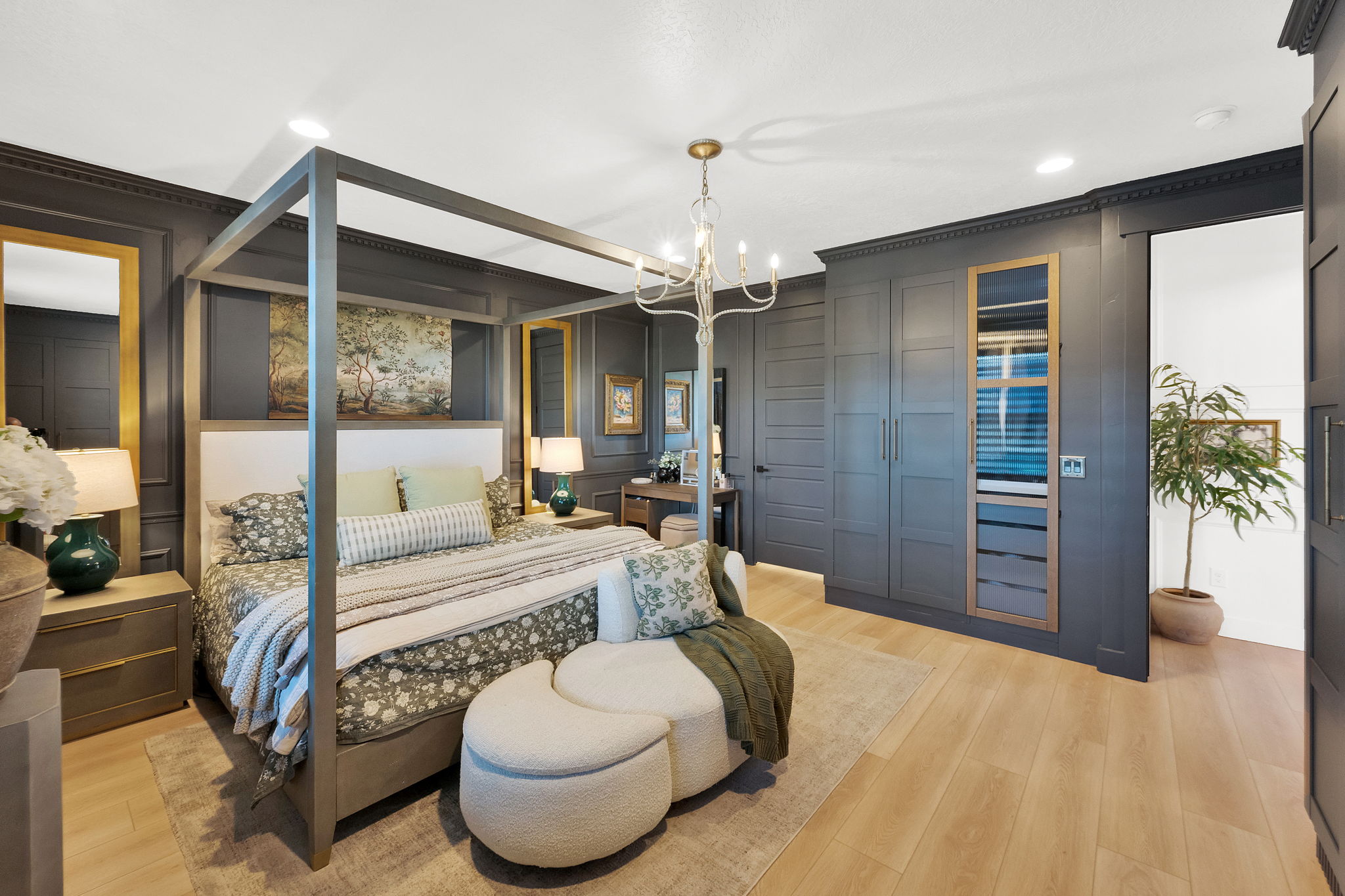 Dark-paneled walls featuring crown molding and recessed lighting