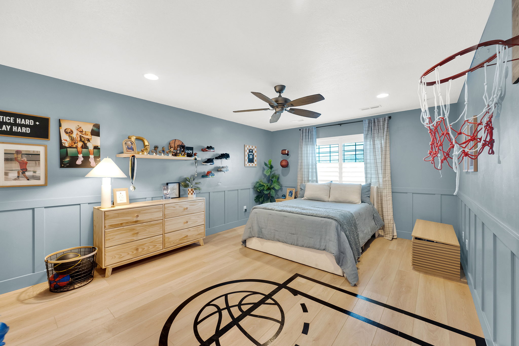 Room featuring light wood-finish flooring with a basketball court graphic, recessed lighting, and a ceiling fan