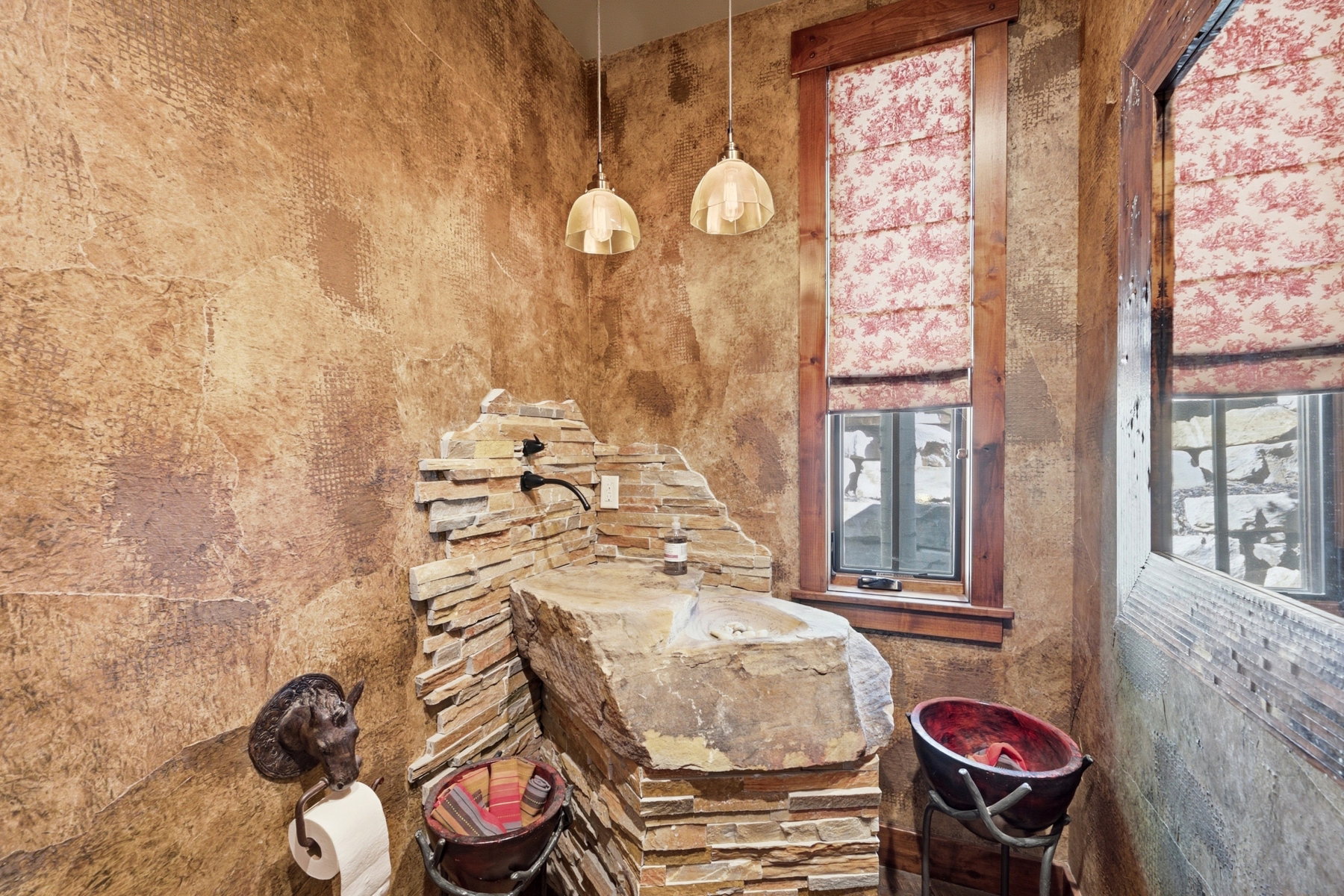 Stone-clad vanity with integrated basin