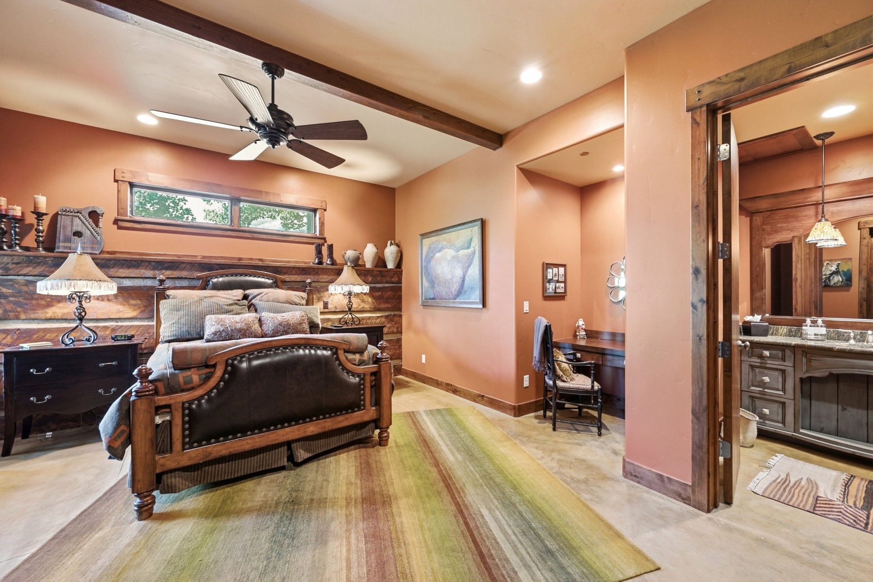 Spacious room featuring a wood-finish bed frame, wood-finish flooring, and recessed lighting
