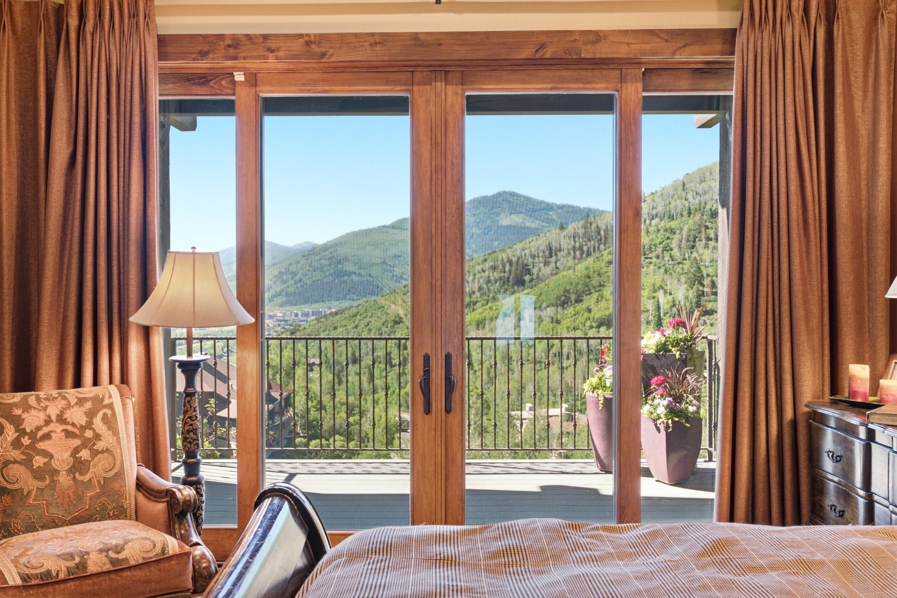 Expansive mountain scenery visible through full-light patio doors