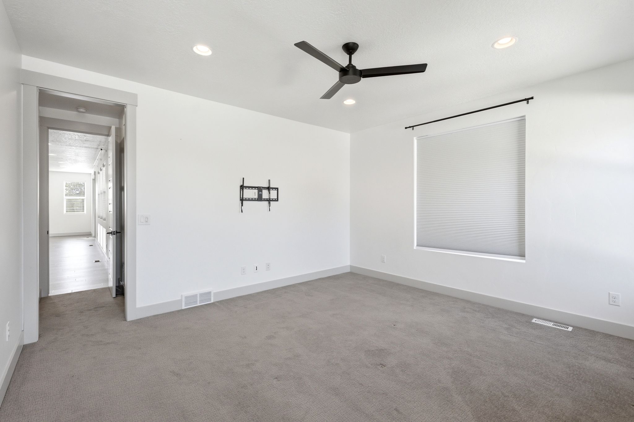 Neutral-toned carpeting paired with white walls